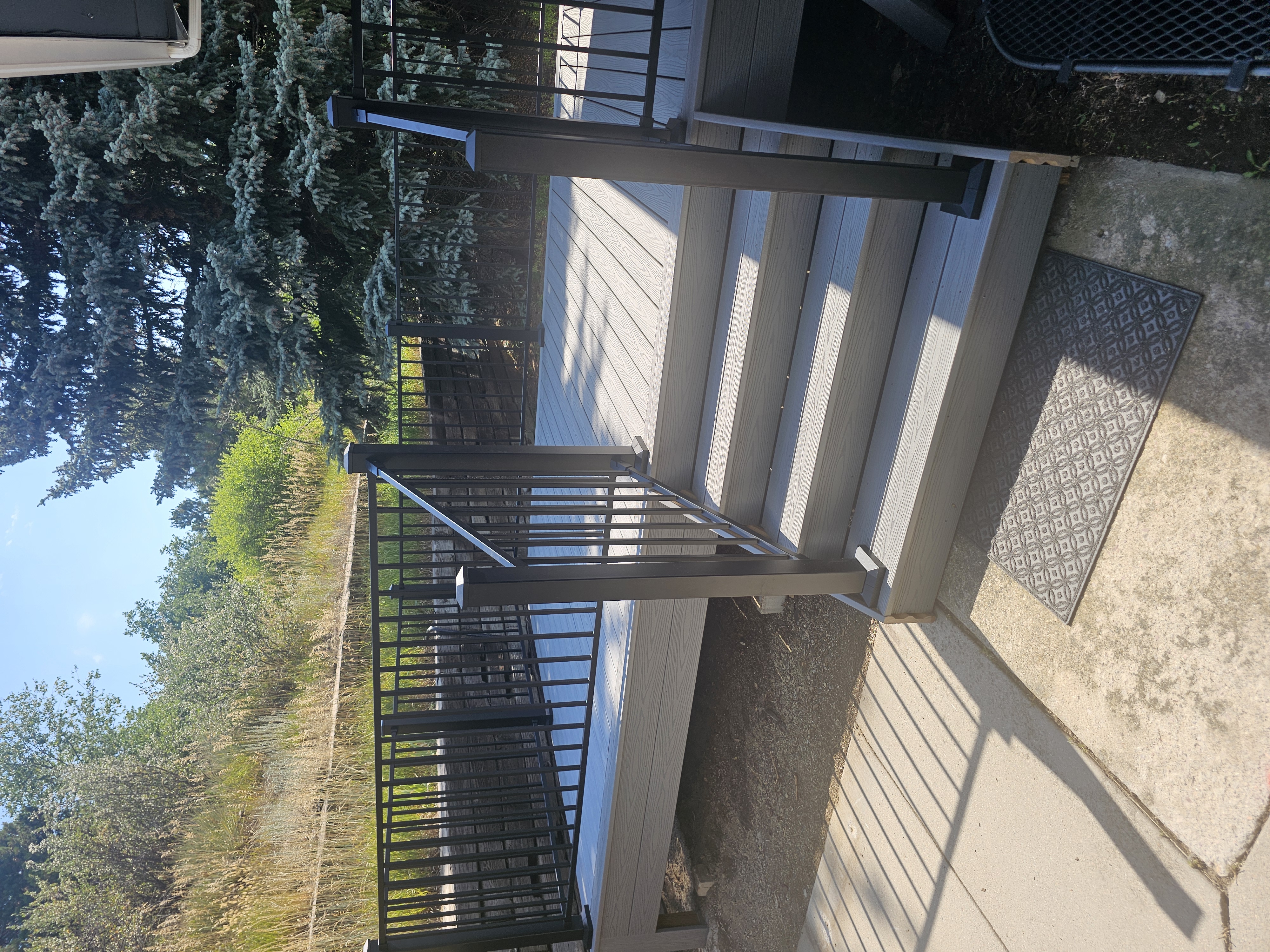 Custom cedar pergola over a backyard deck in the Pikes Peak region