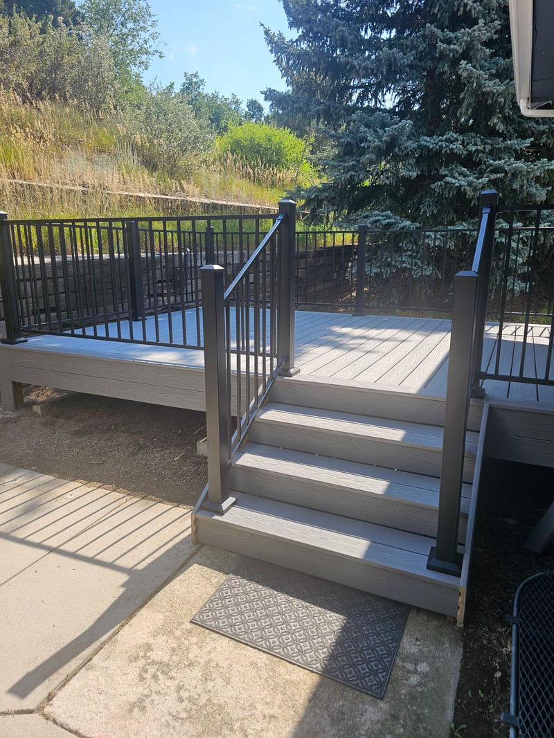 Custom cedar pergola over a backyard deck in the Pikes Peak region