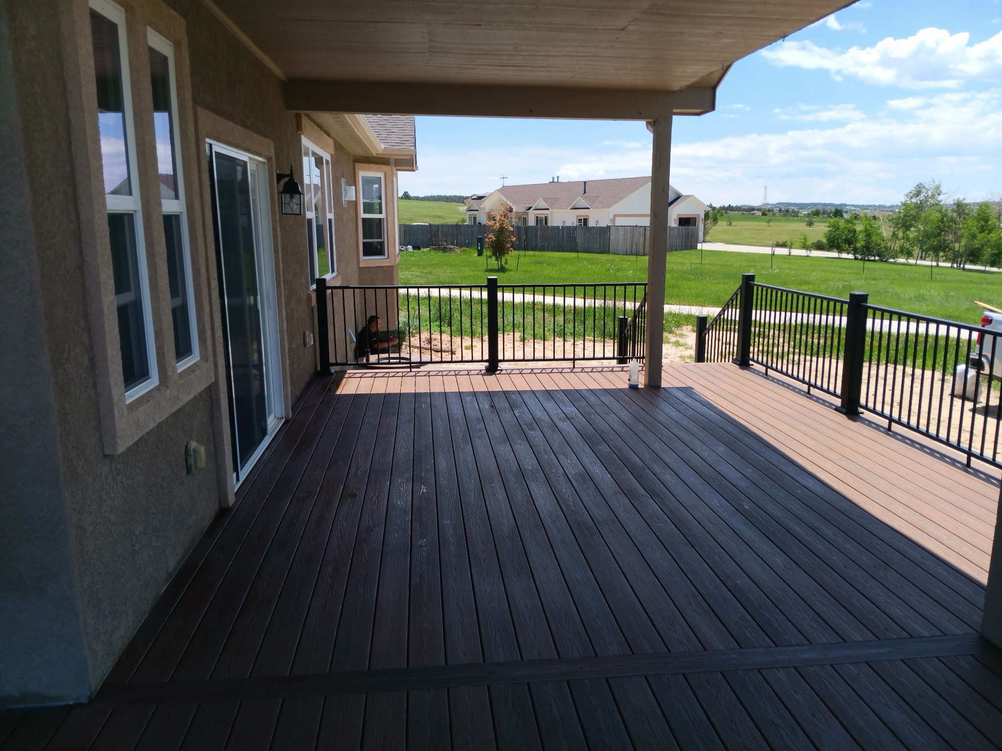 Backyard deck with pergola and outdoor dining area