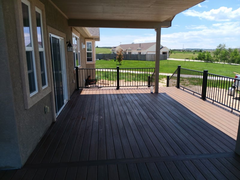 Backyard deck with pergola and outdoor dining area