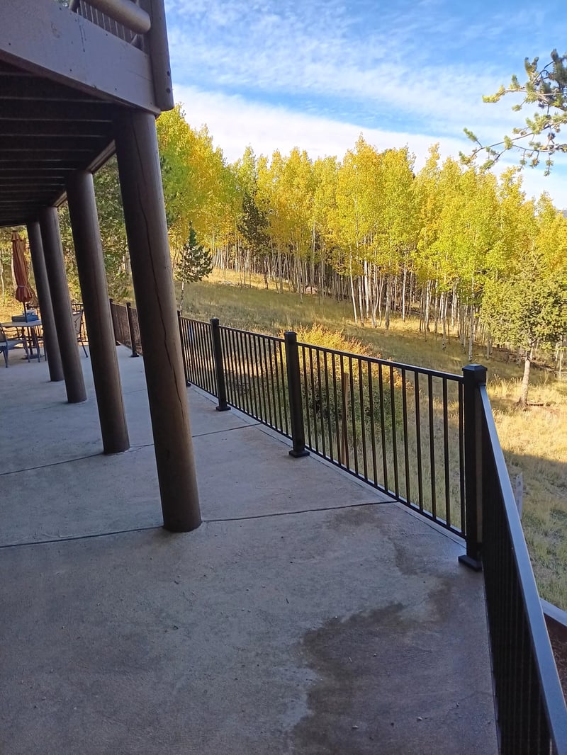 Low-profile ground-level deck with wide plank composite boards
