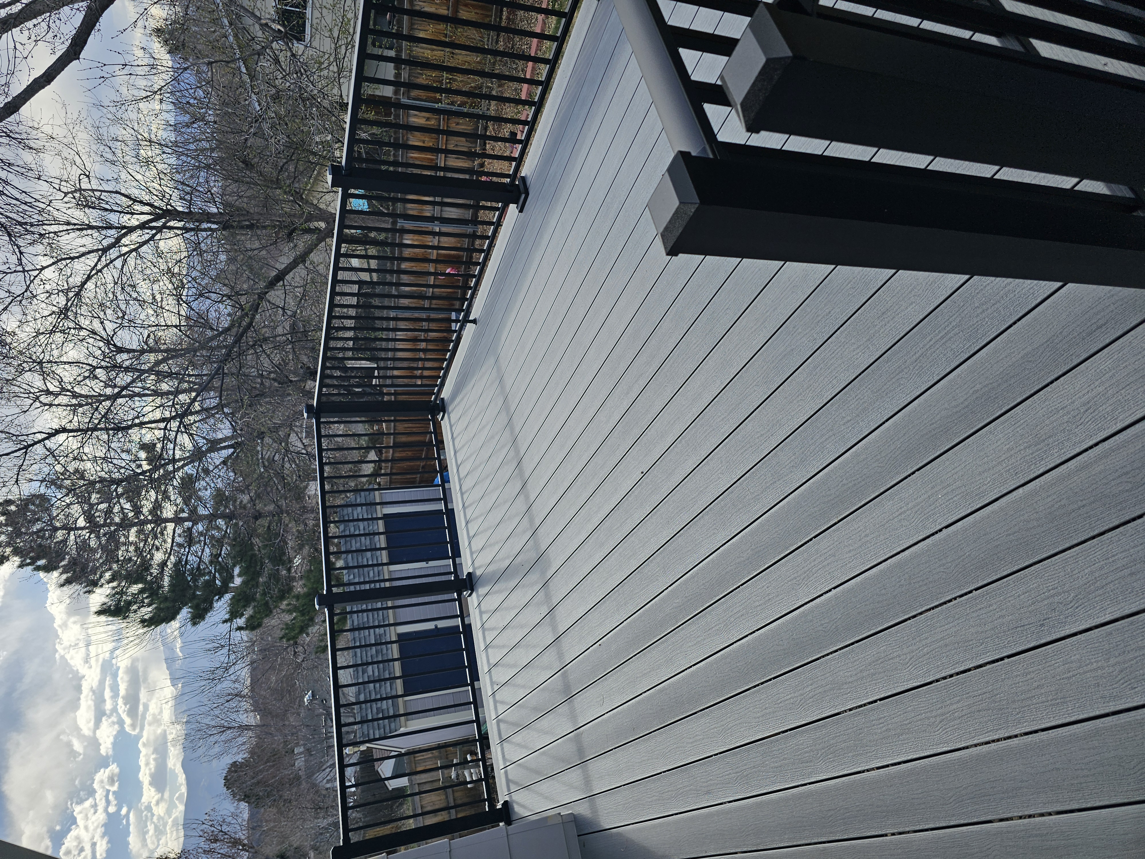 Multi-level custom wood deck with railings in Colorado Springs
