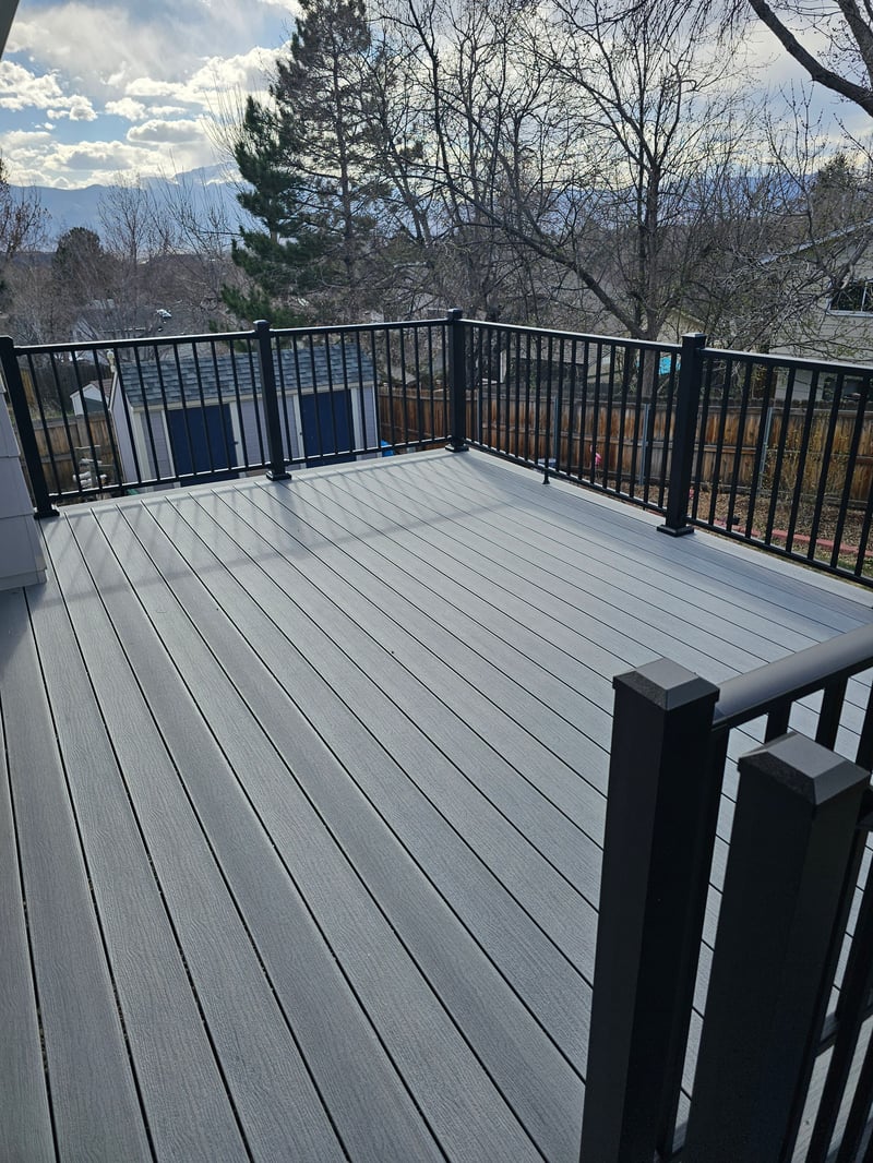 Multi-level custom wood deck with railings in Colorado Springs