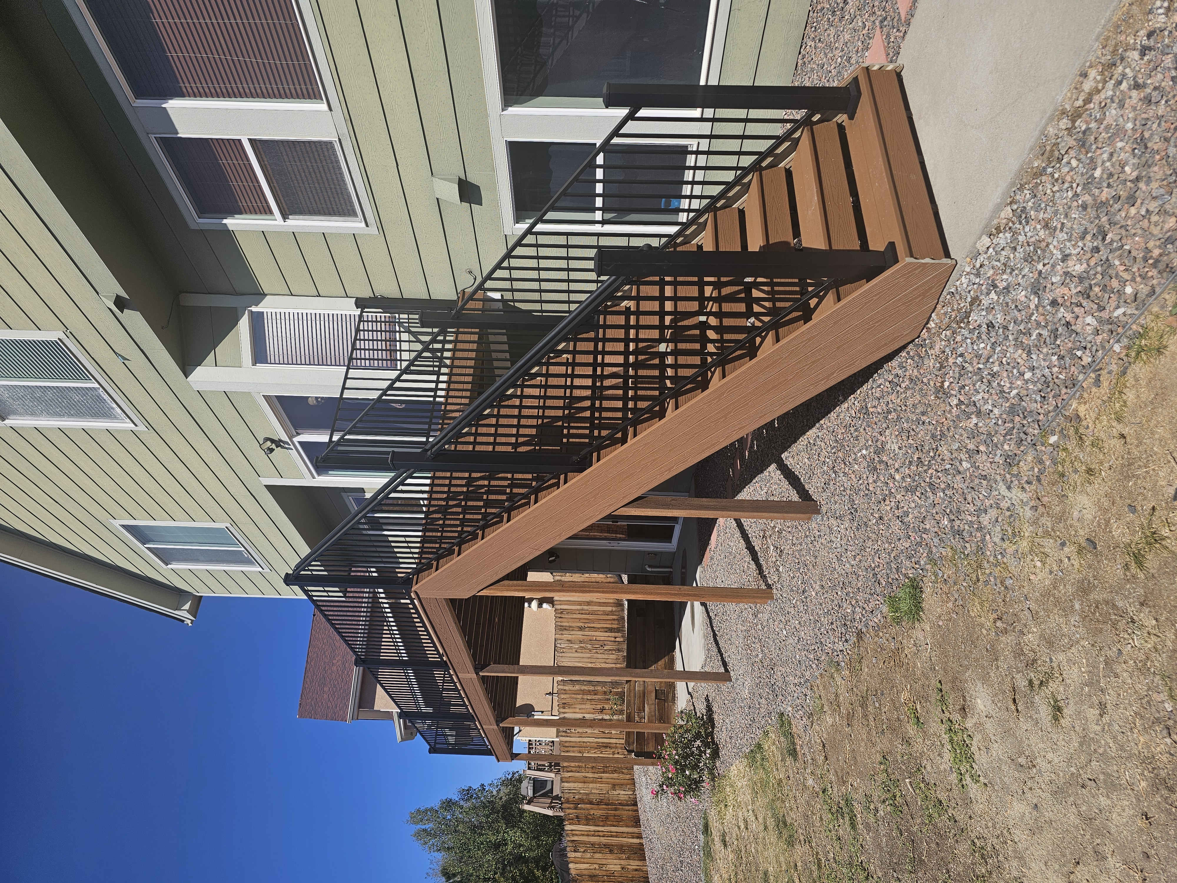 Wraparound custom deck with built-in bench seating