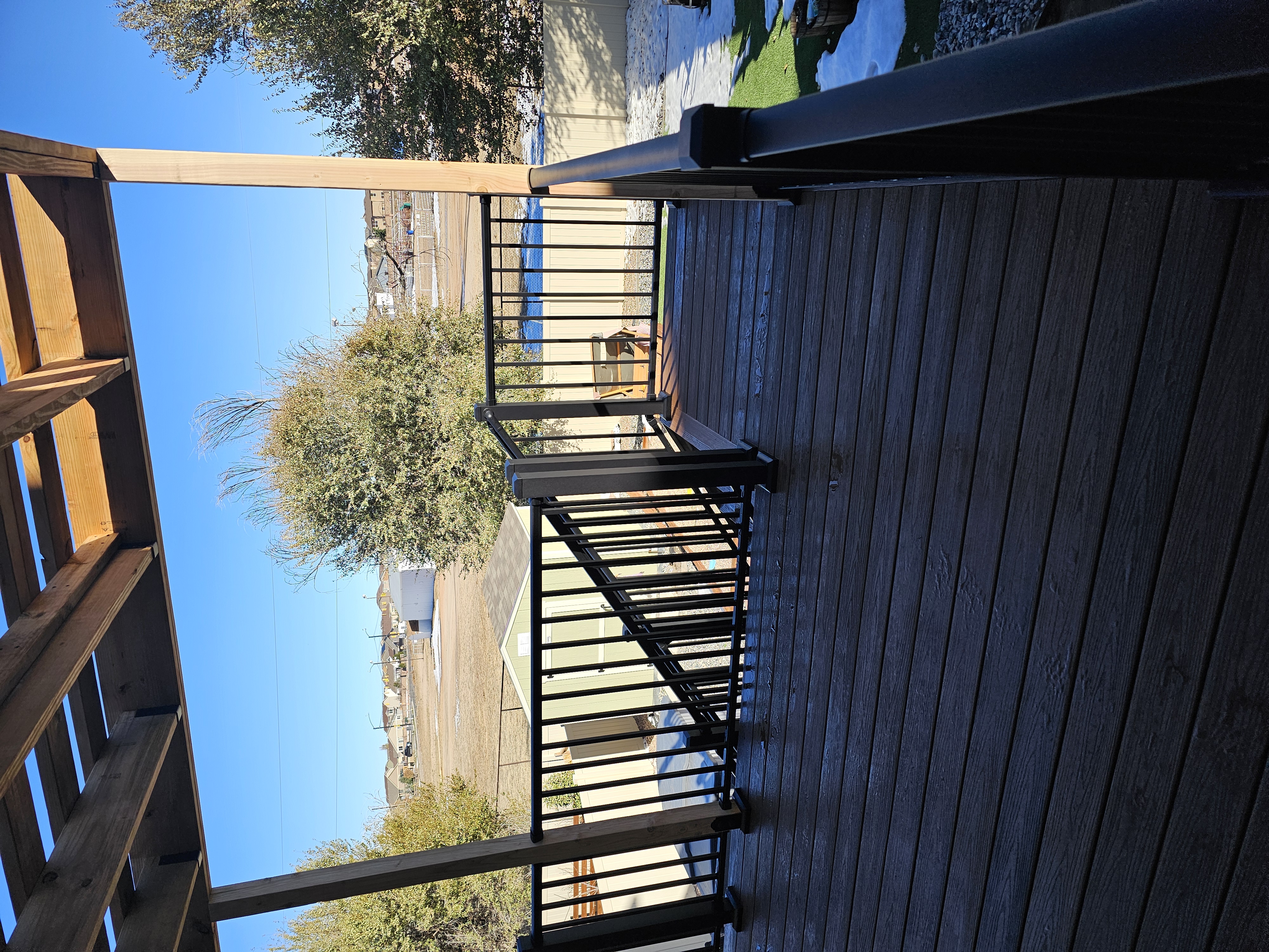 Covered patio and outdoor living space attached to a Colorado Springs home