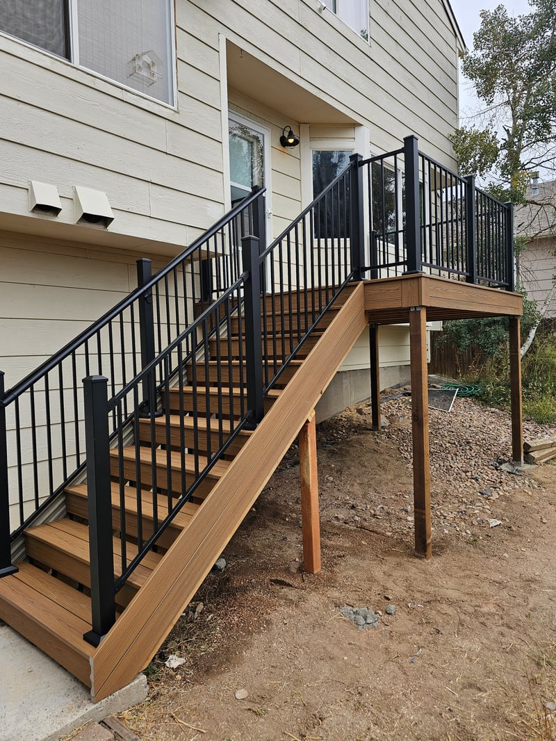 Multi-level custom wood deck with railings in Colorado Springs