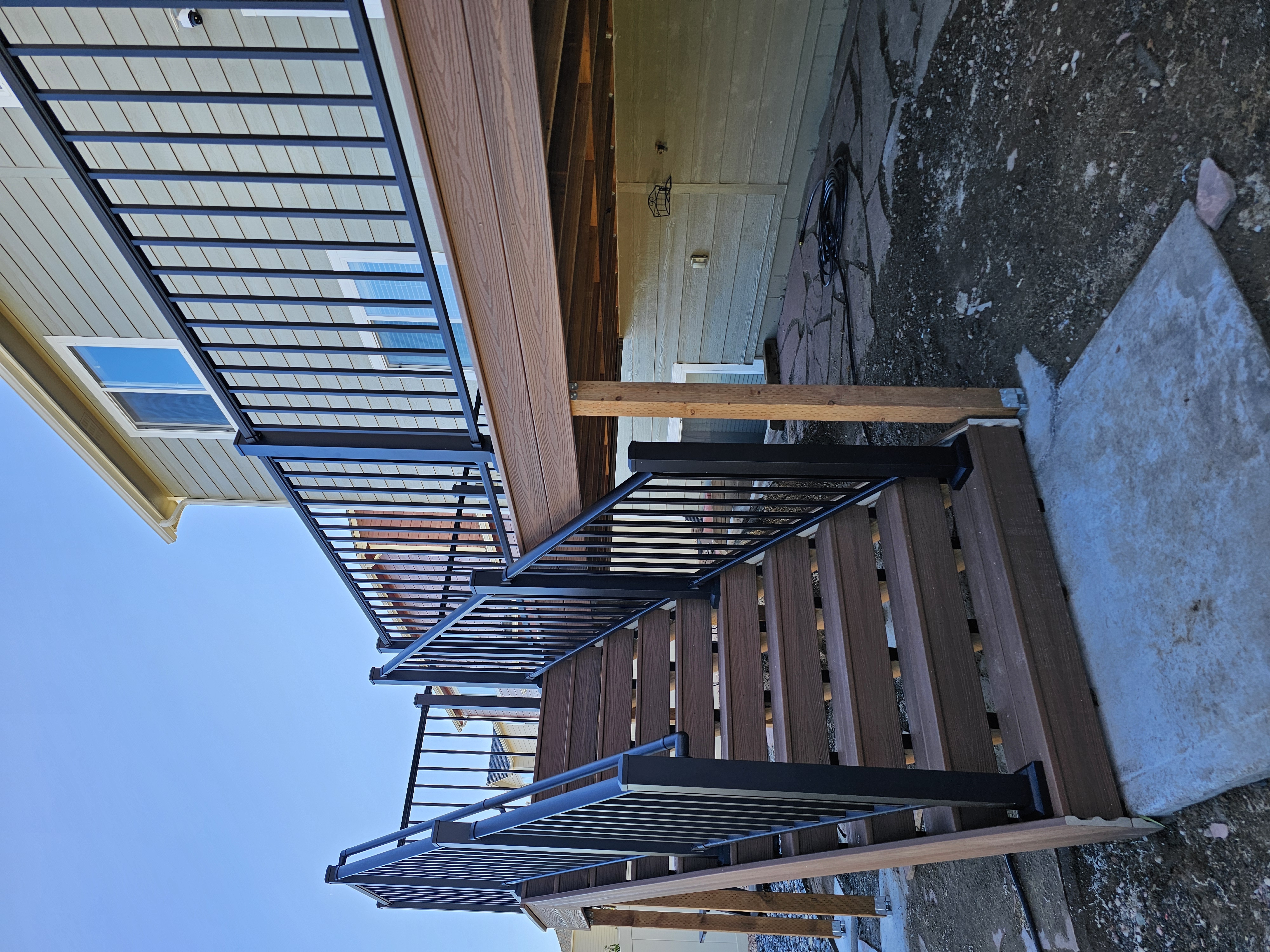 Backyard deck with pergola and outdoor dining area