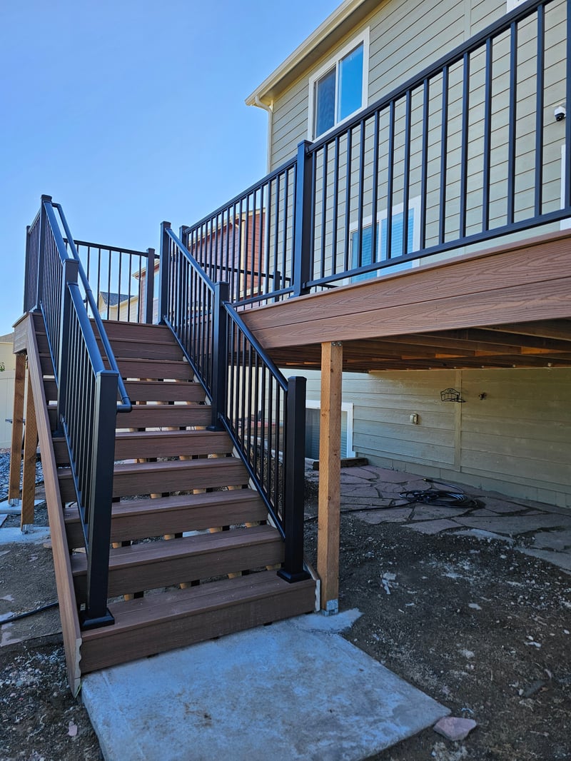 Backyard deck with pergola and outdoor dining area