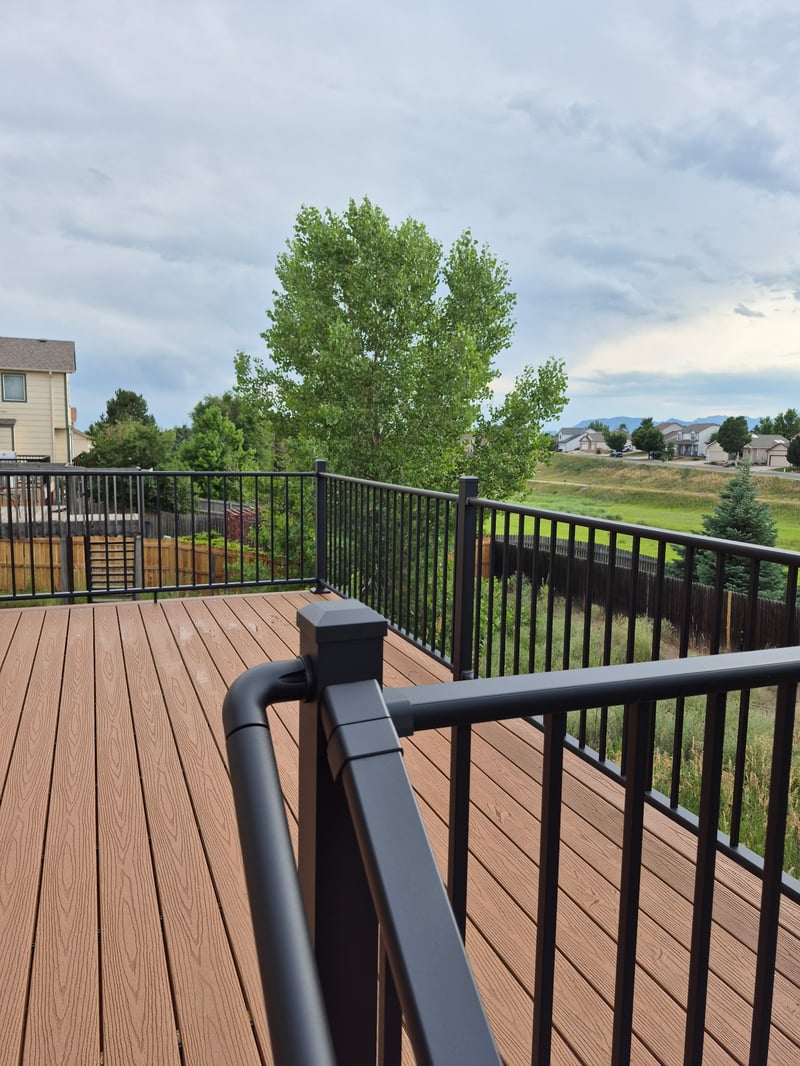 Multi-level custom wood deck with railings in Colorado Springs