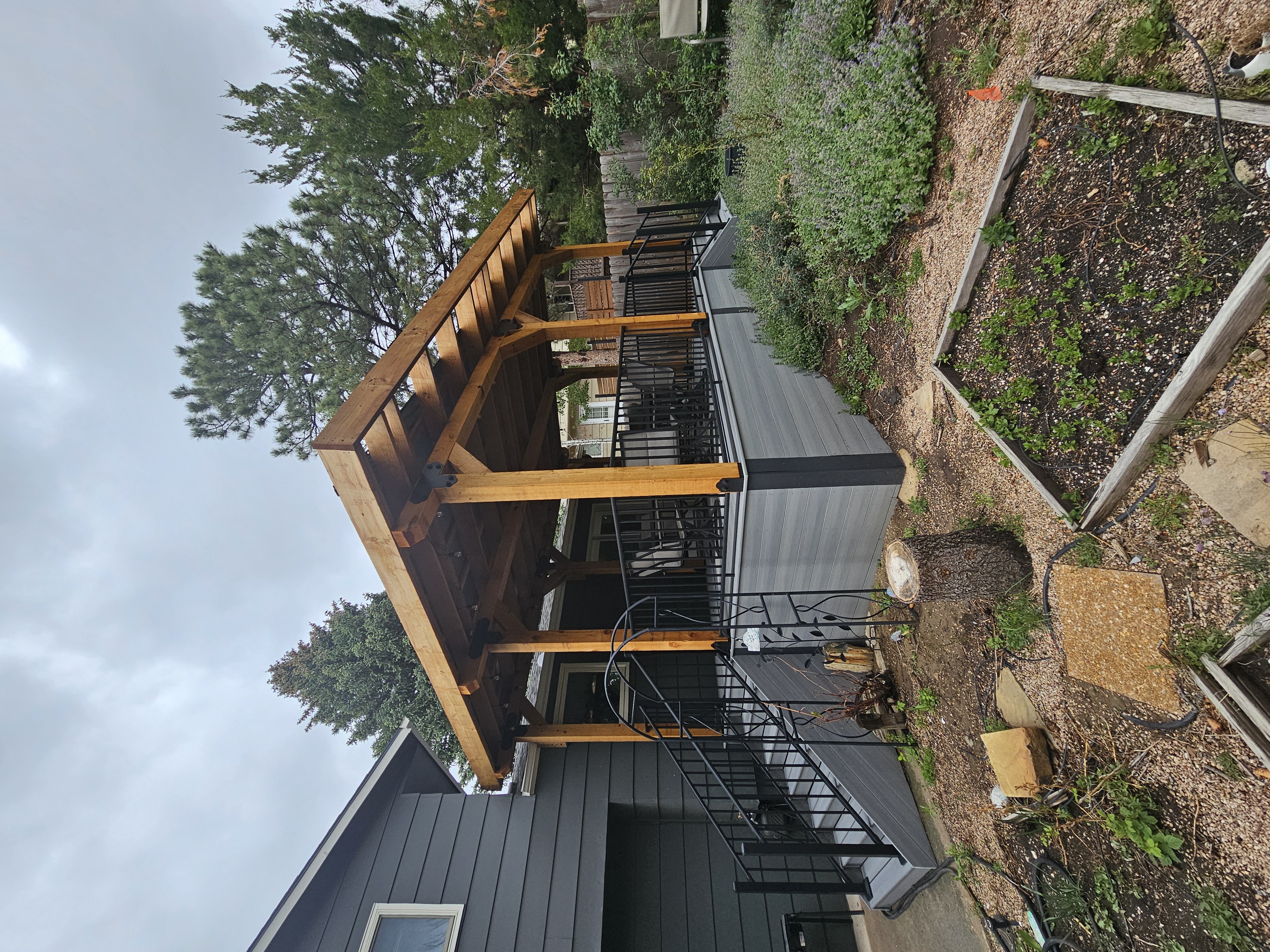 Covered patio and outdoor living space attached to a Colorado Springs home