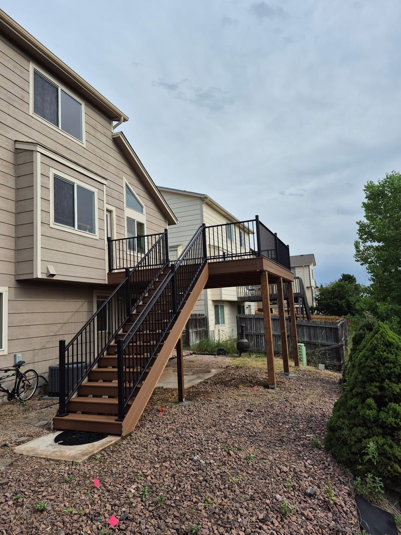 Deck stairs with landing and matching railings