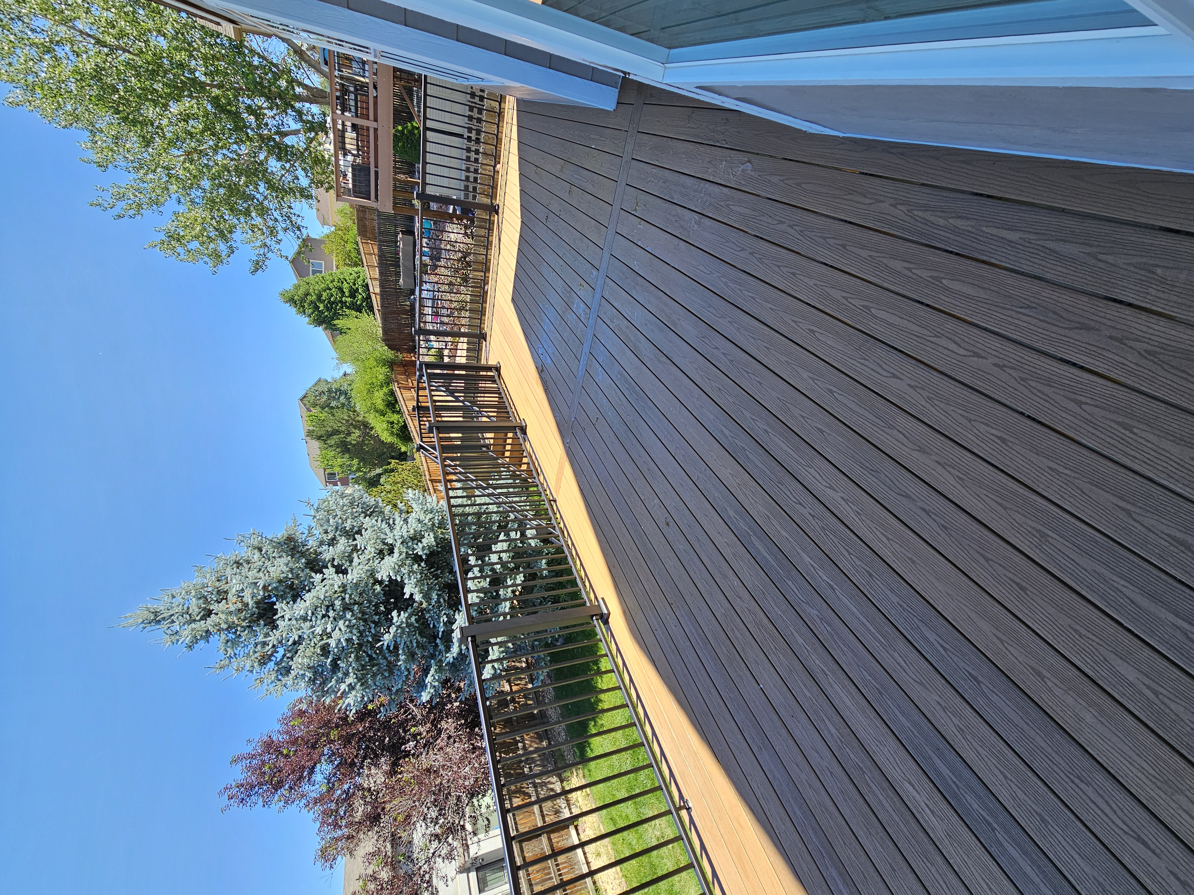 Backyard deck with pergola and outdoor dining area