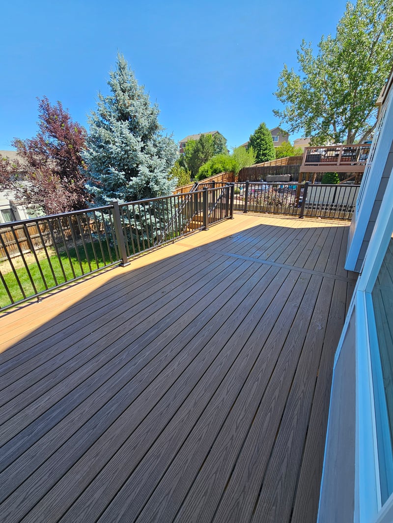 Backyard deck with pergola and outdoor dining area