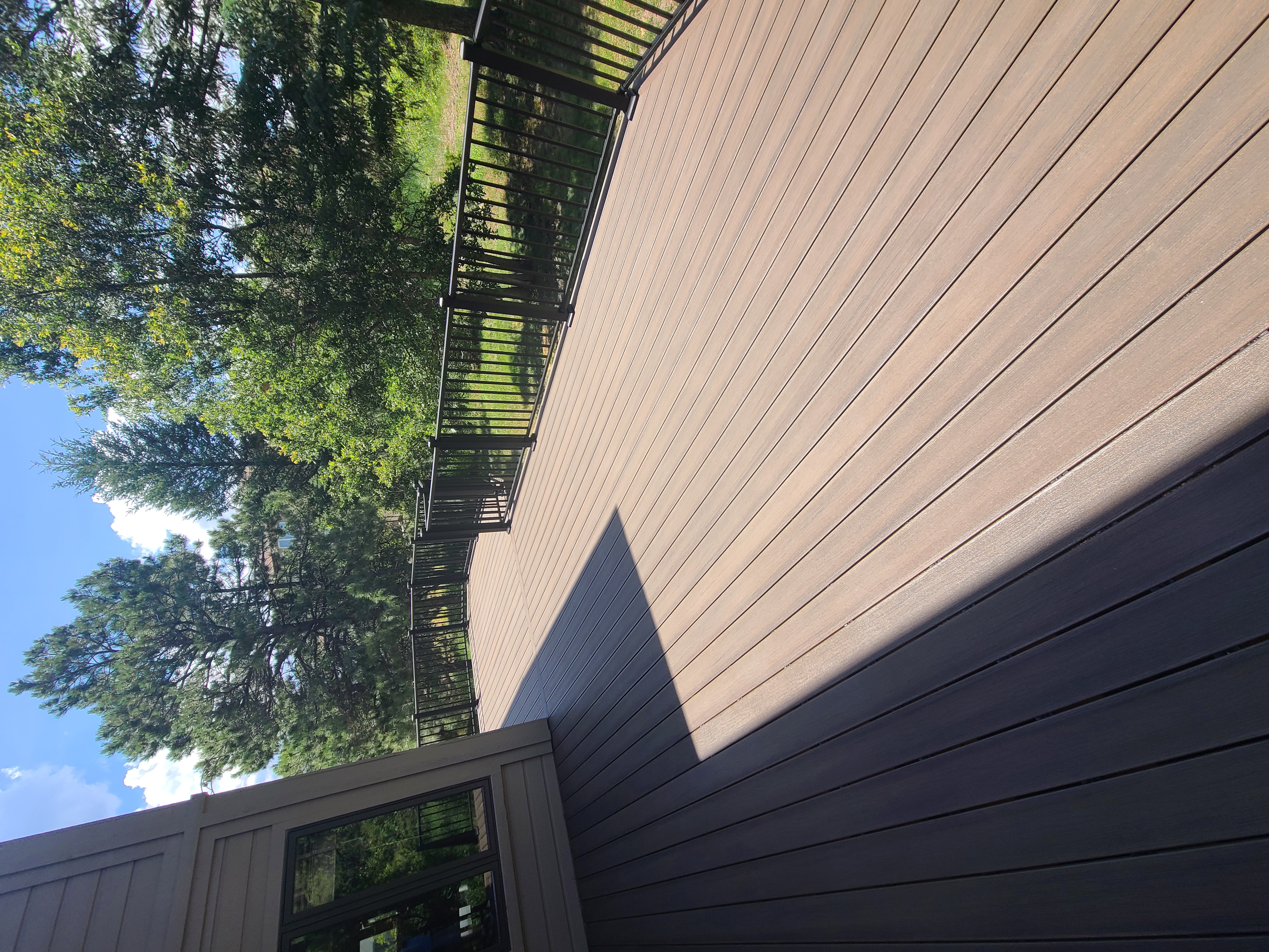 Multi-level custom wood deck with railings in Colorado Springs