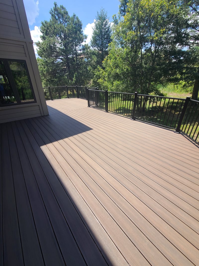Multi-level custom wood deck with railings in Colorado Springs