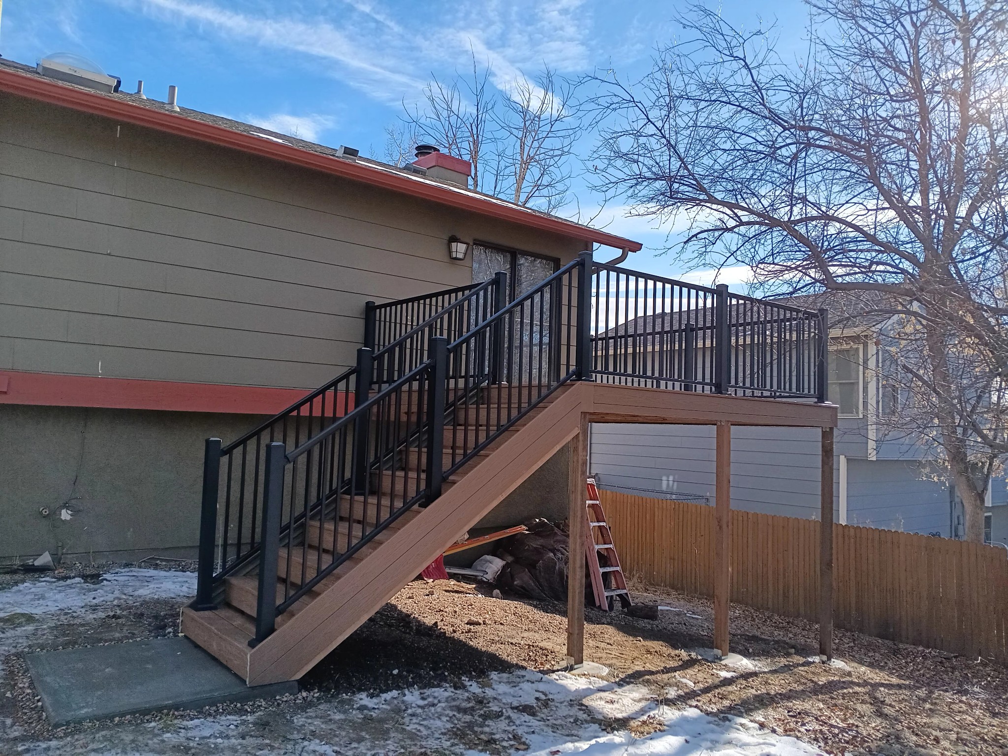 Deck stairs with landing and matching railings