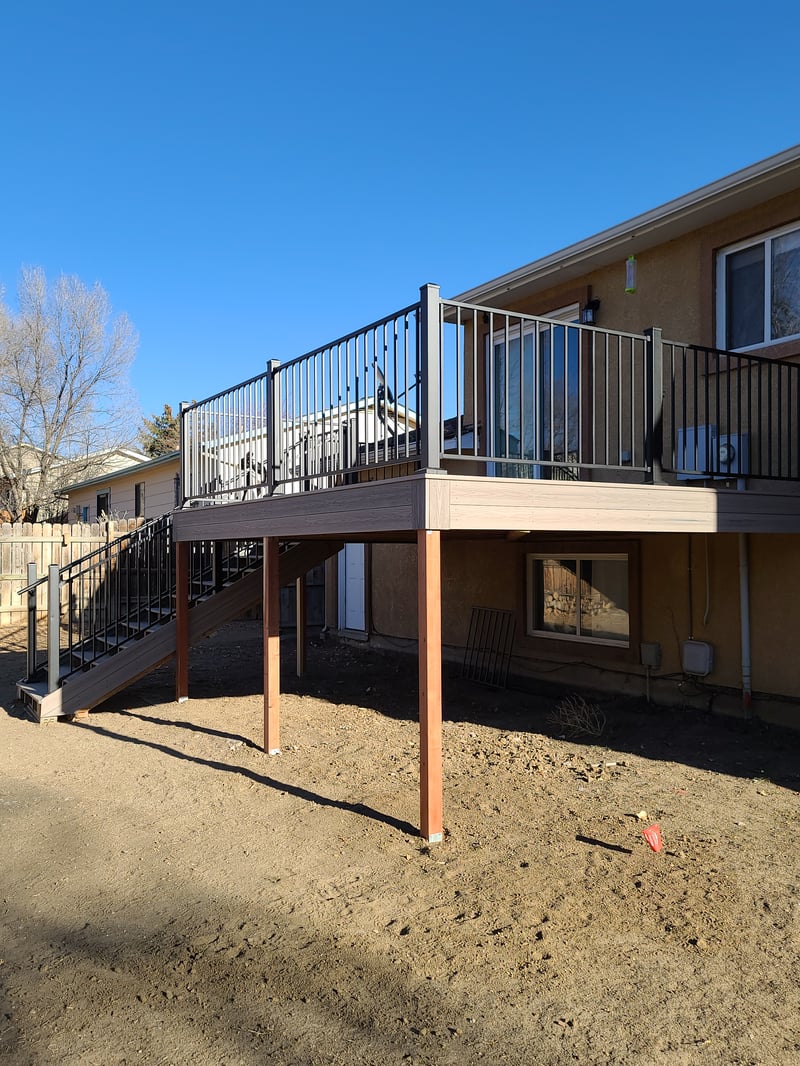Multi-level custom wood deck with railings in Colorado Springs