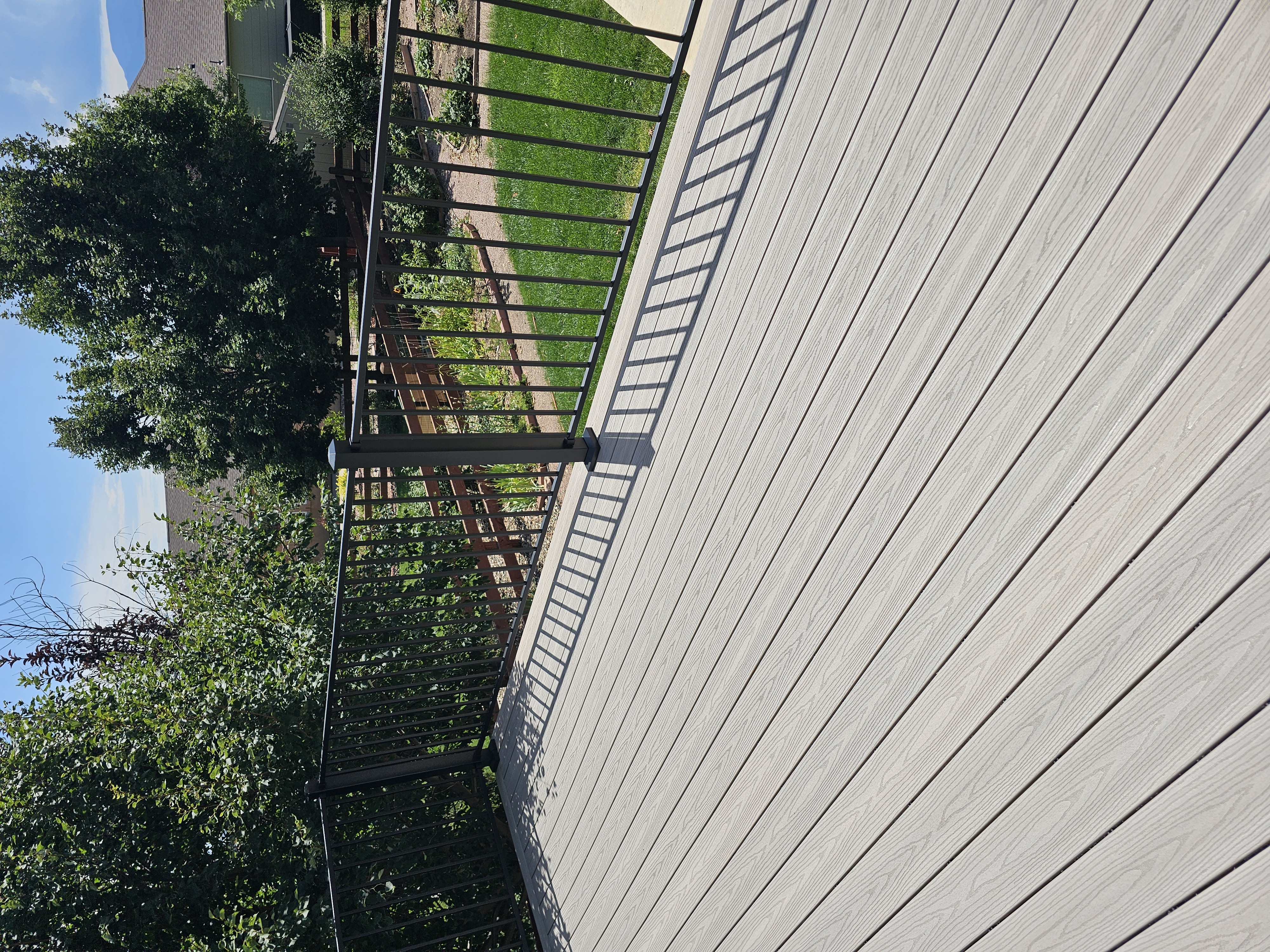 Backyard deck with pergola and outdoor dining area