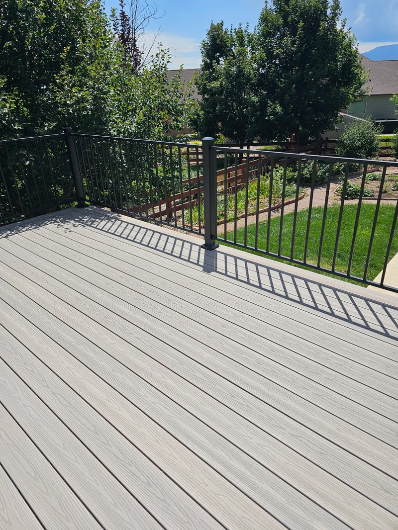 Backyard deck with pergola and outdoor dining area