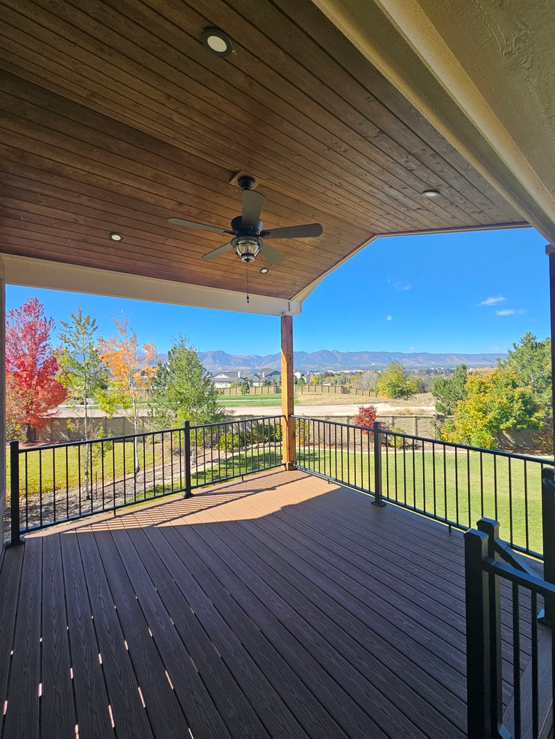 Multi-level custom wood deck with railings in Colorado Springs