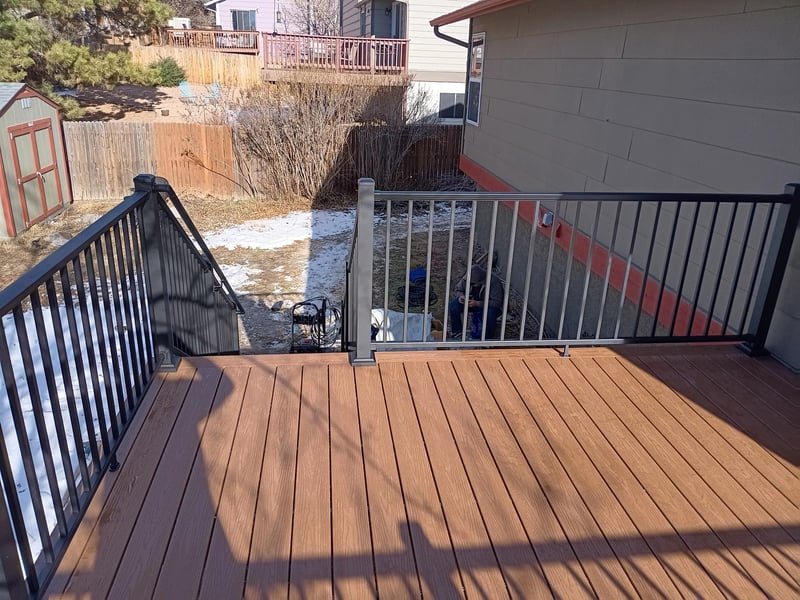 Multi-level custom wood deck with railings in Colorado Springs