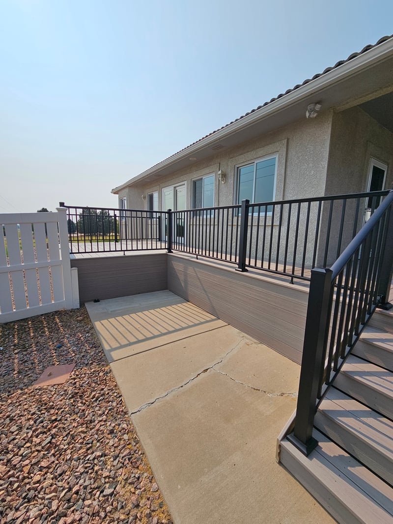 Covered patio and outdoor living space attached to a Colorado Springs home