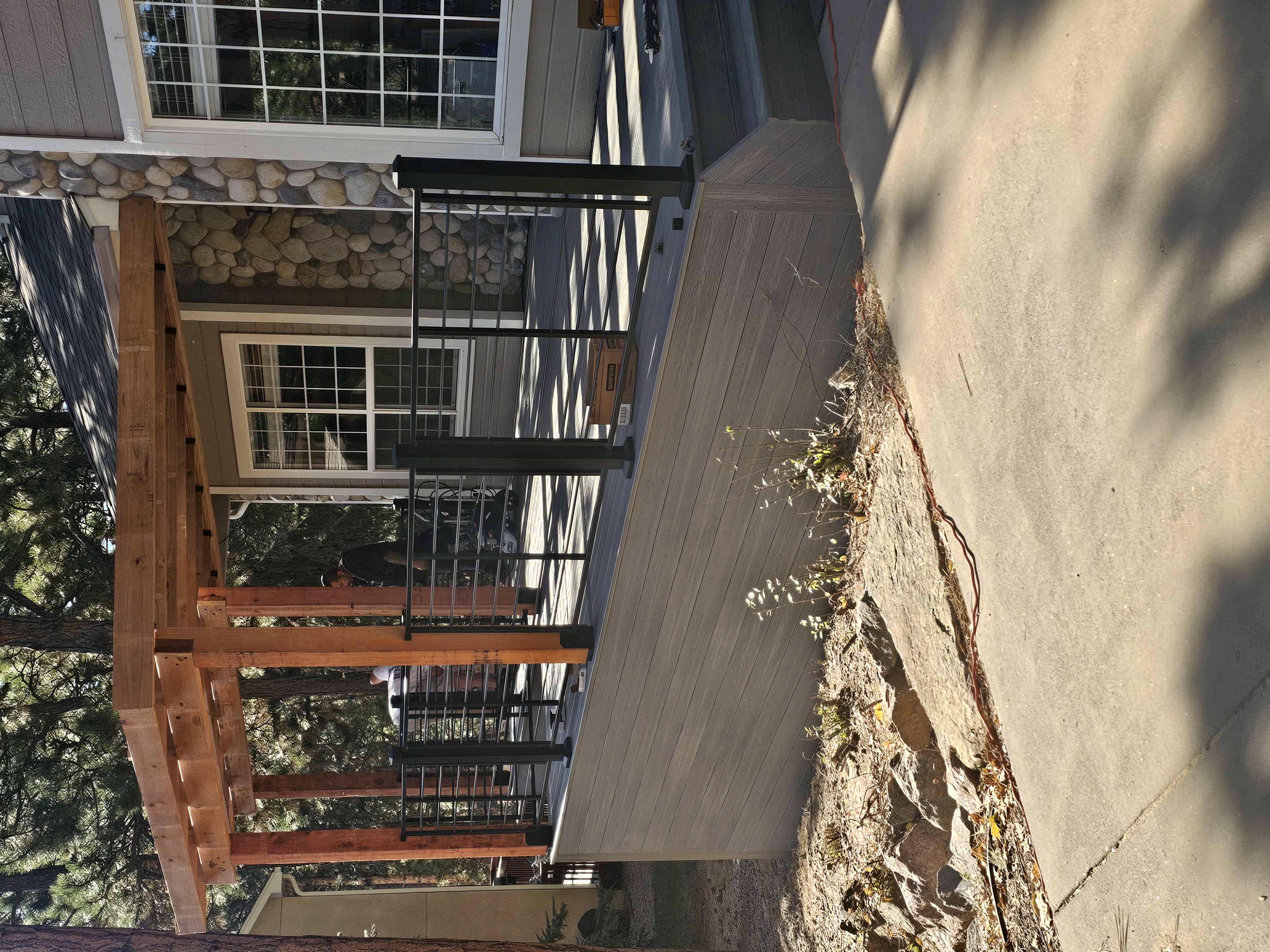 Covered patio and outdoor living space attached to a Colorado Springs home