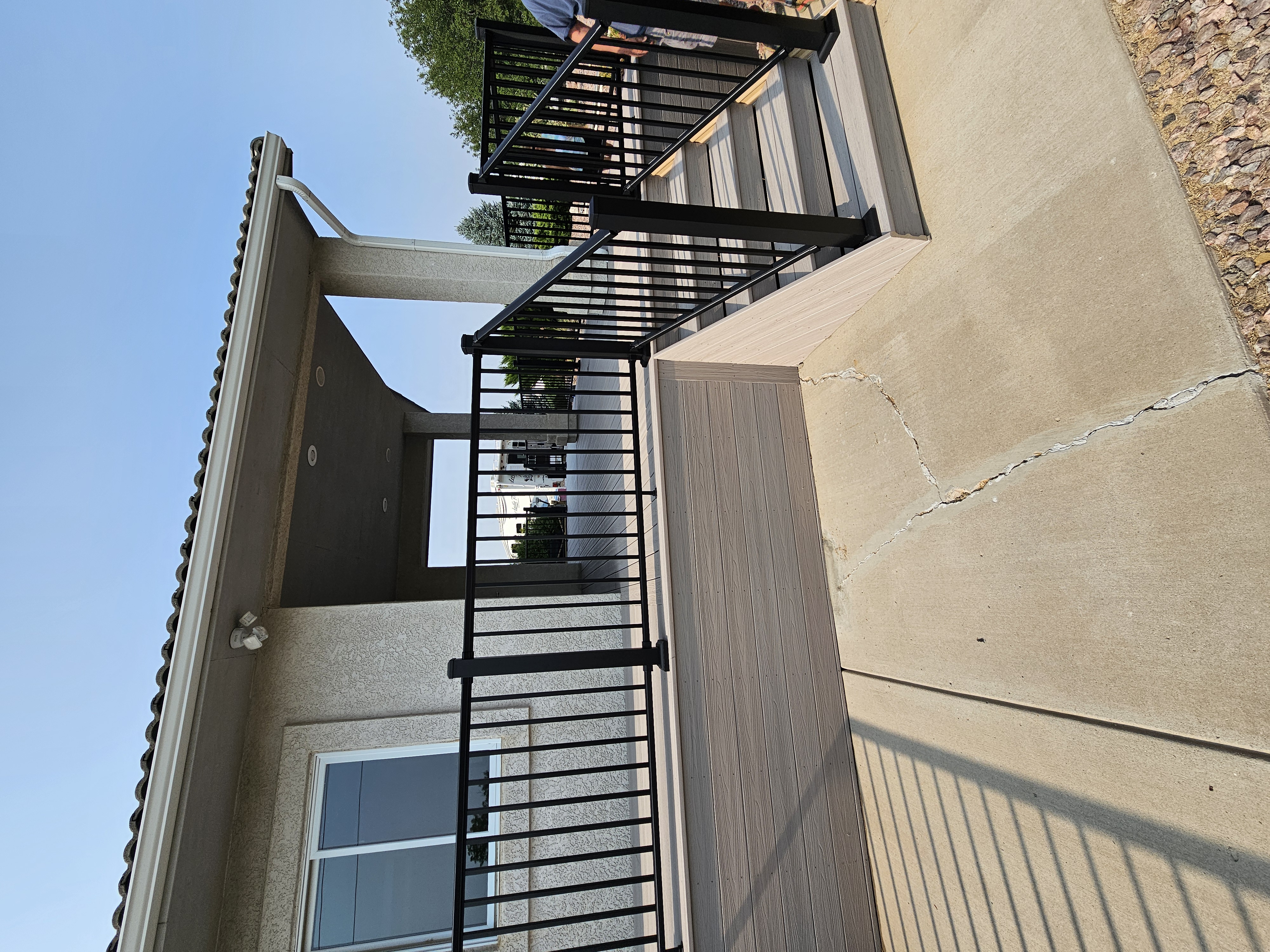 Custom cedar pergola over a backyard deck in the Pikes Peak region