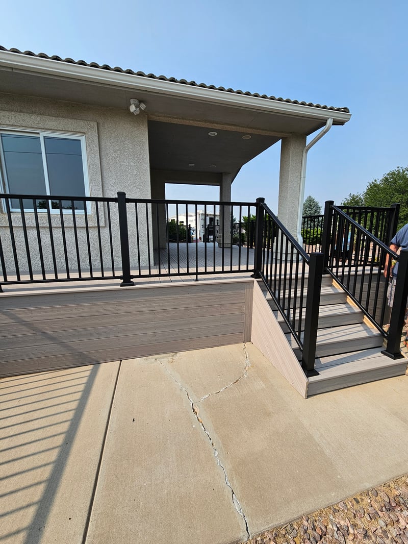 Custom cedar pergola over a backyard deck in the Pikes Peak region