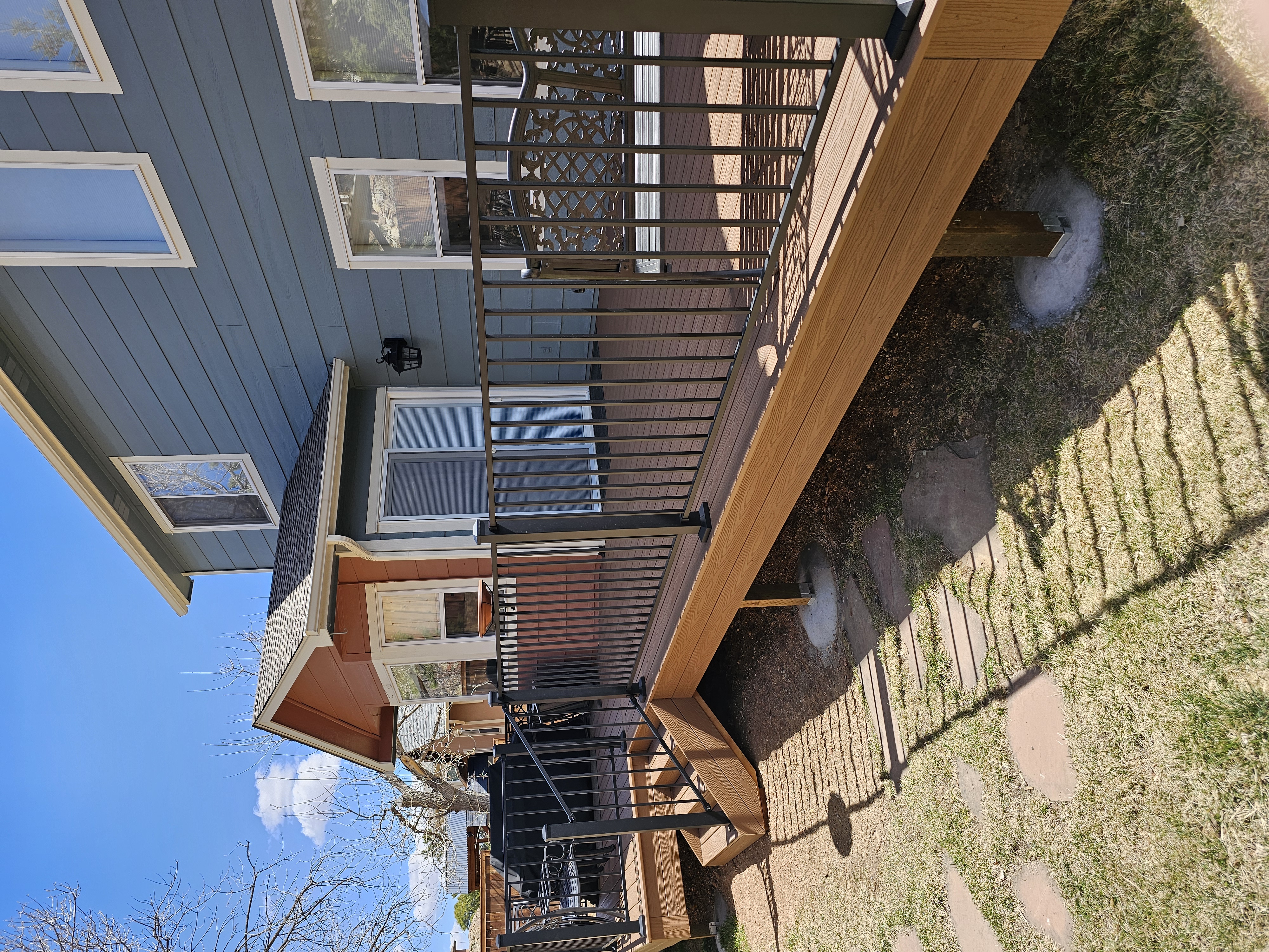 Custom cedar pergola over a backyard deck in the Pikes Peak region