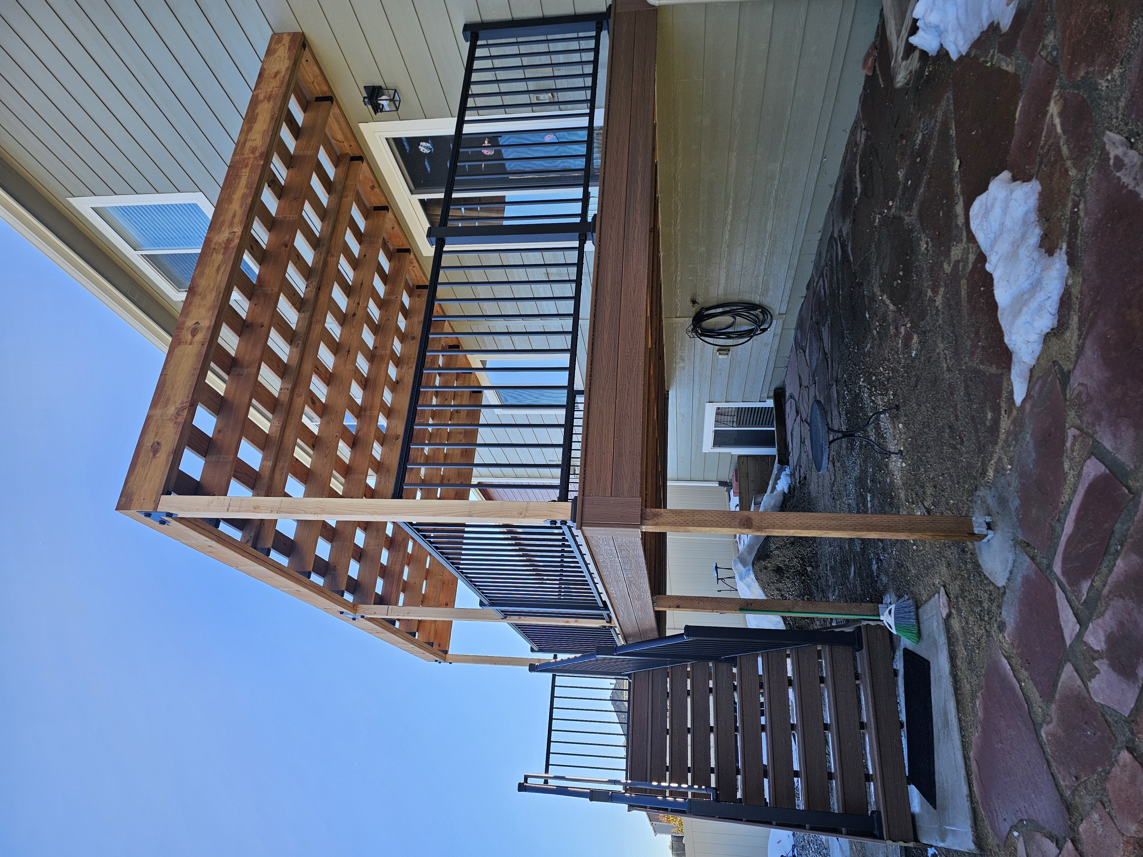 Multi-level custom wood deck with railings in Colorado Springs