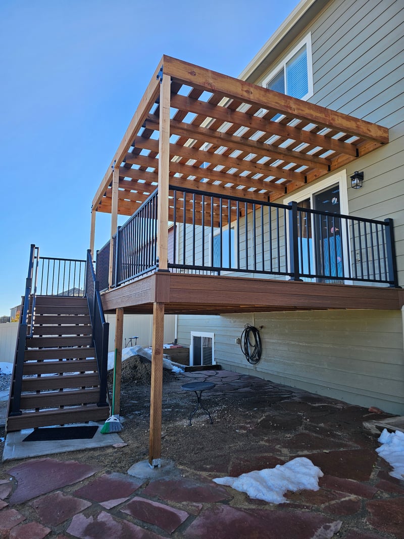 Multi-level custom wood deck with railings in Colorado Springs
