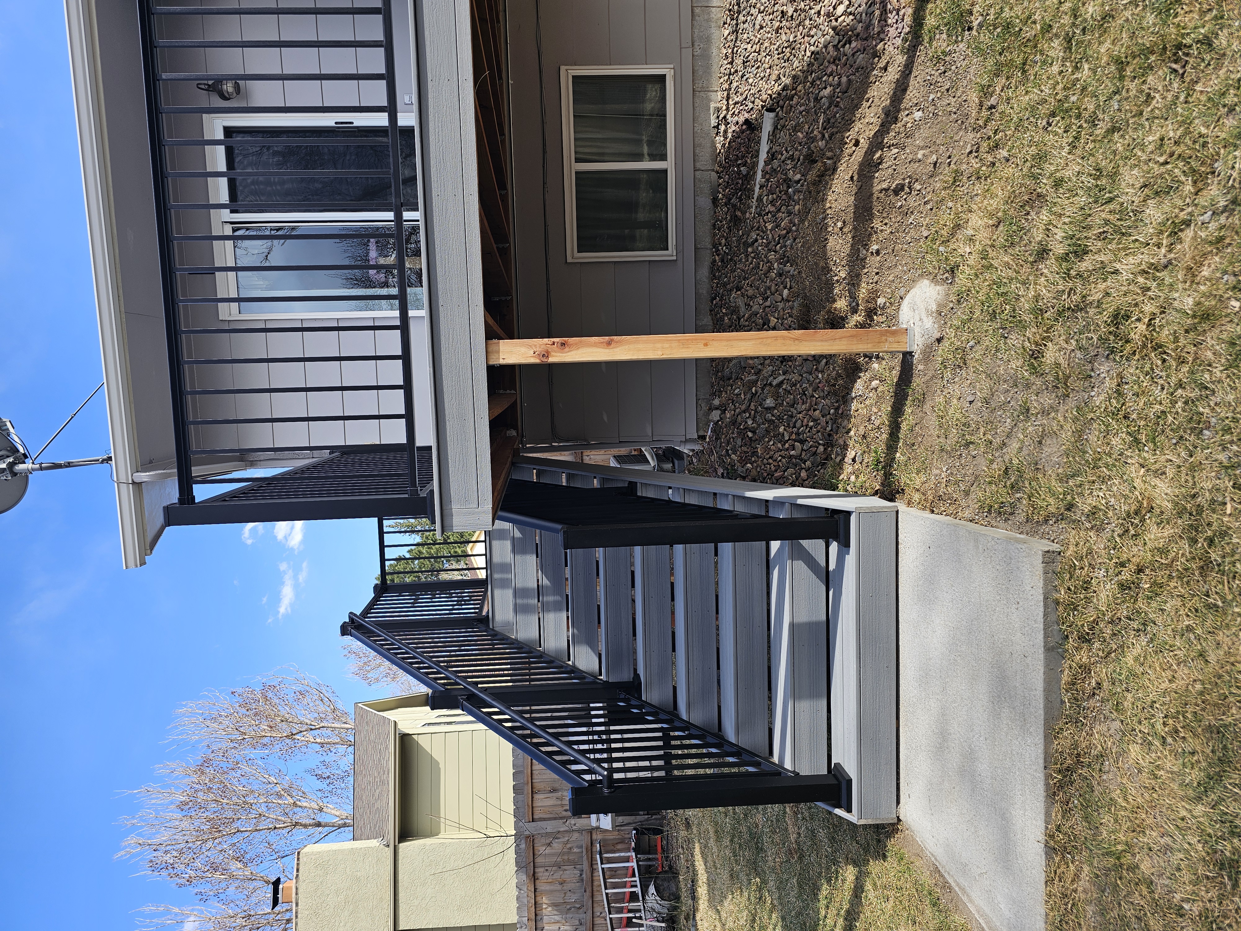 Deck stairs with landing and matching railings
