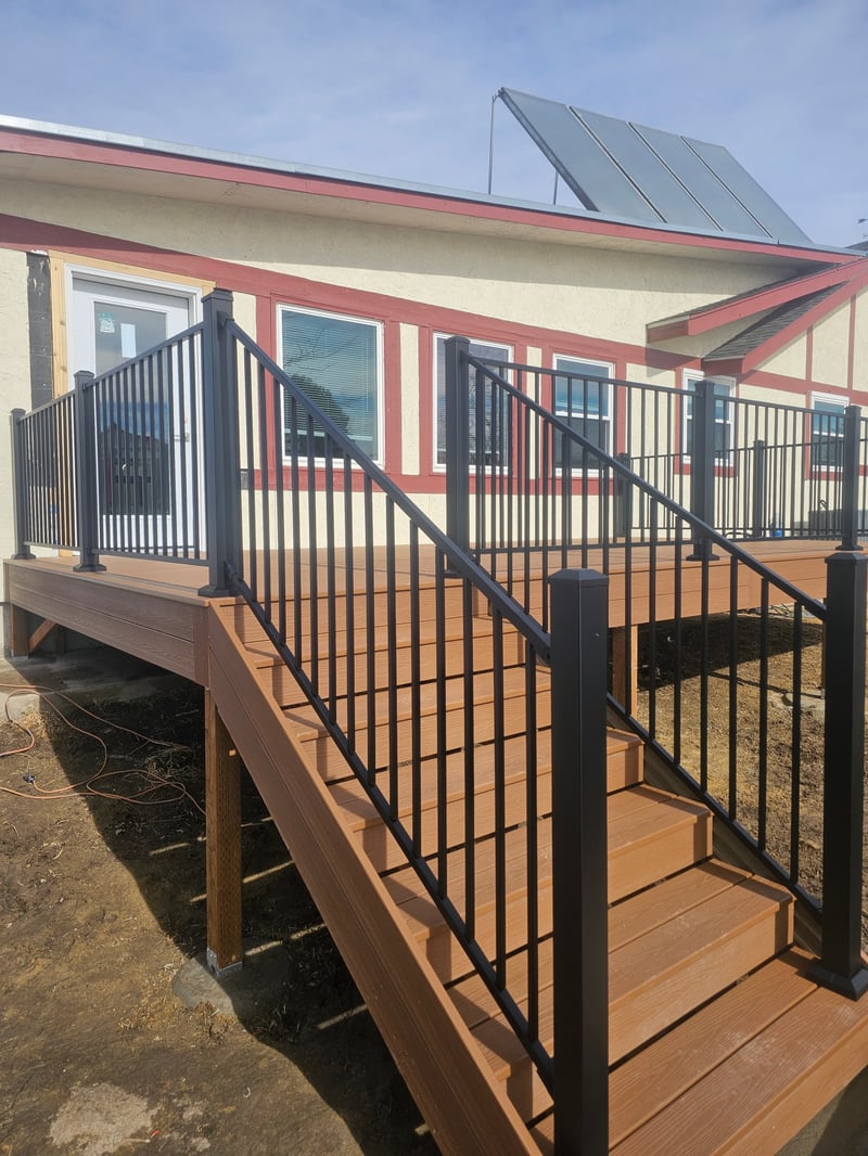 Finished composite deck with picture-frame border detail