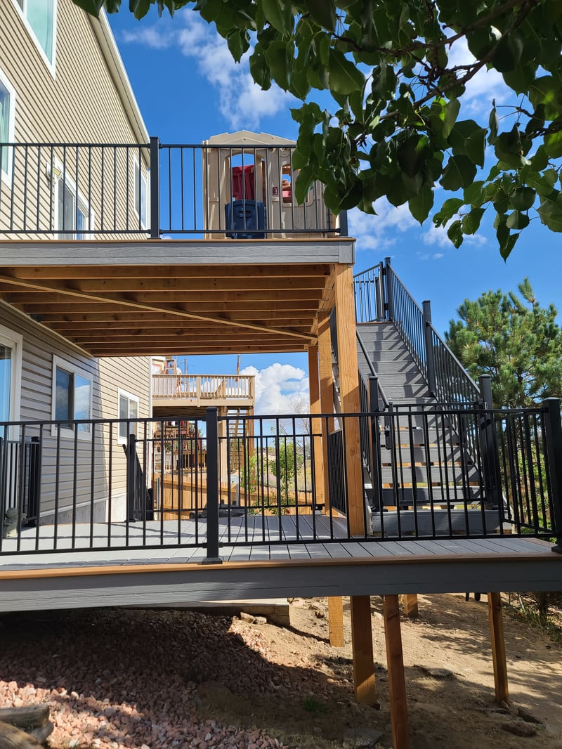 Custom cedar pergola over a backyard deck in the Pikes Peak region