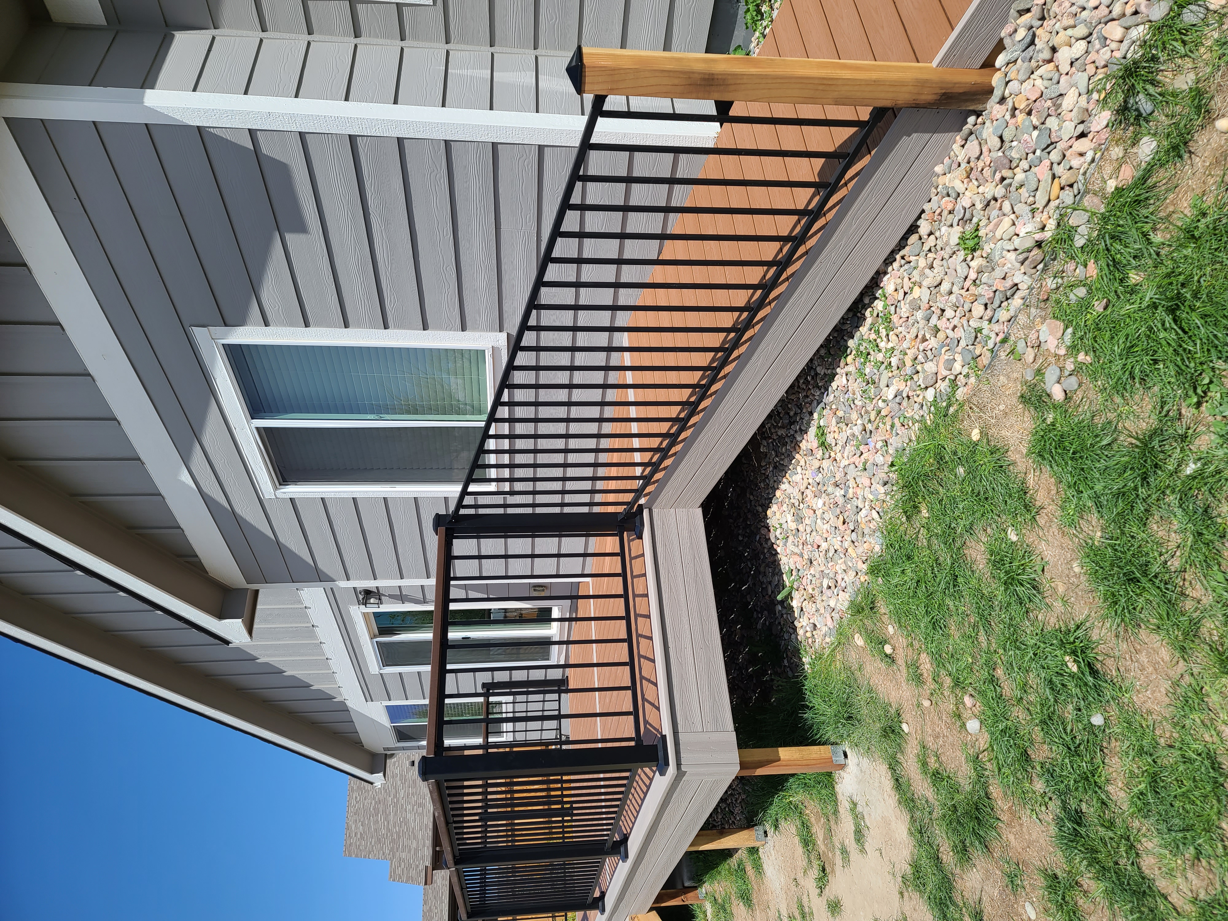 Backyard deck with pergola and outdoor dining area