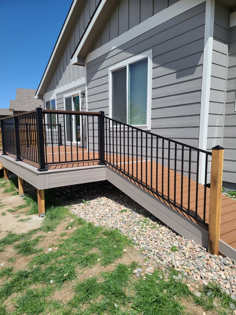 Backyard deck with pergola and outdoor dining area