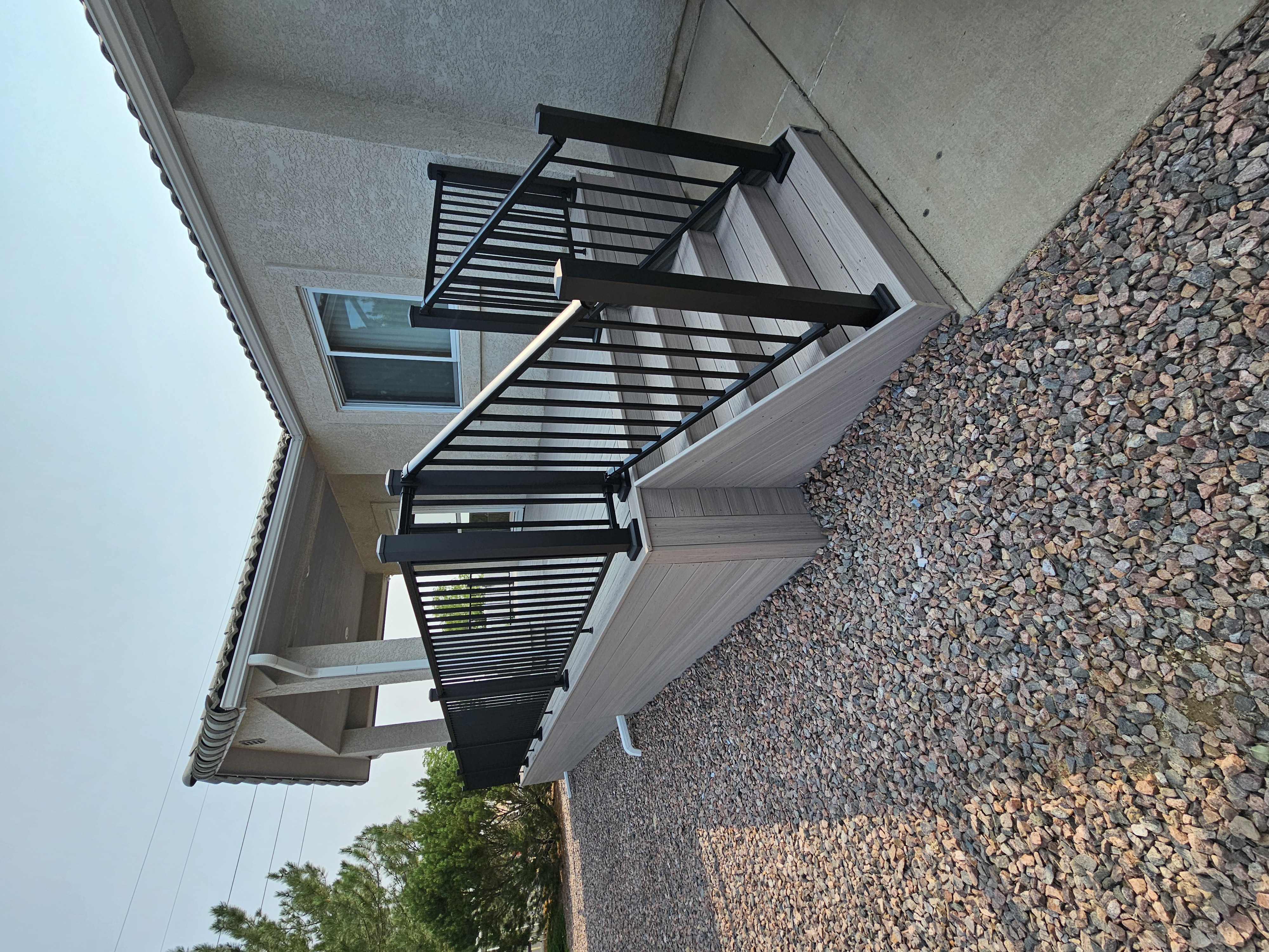 Multi-level custom wood deck with railings in Colorado Springs