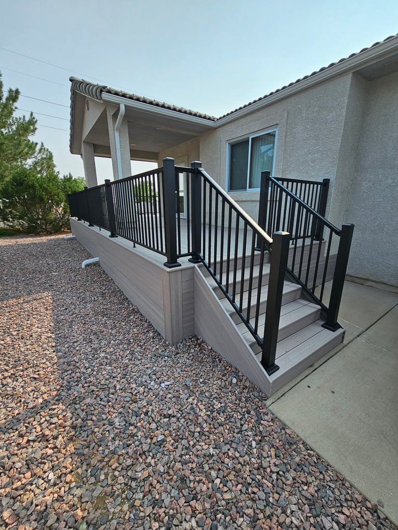 Multi-level custom wood deck with railings in Colorado Springs