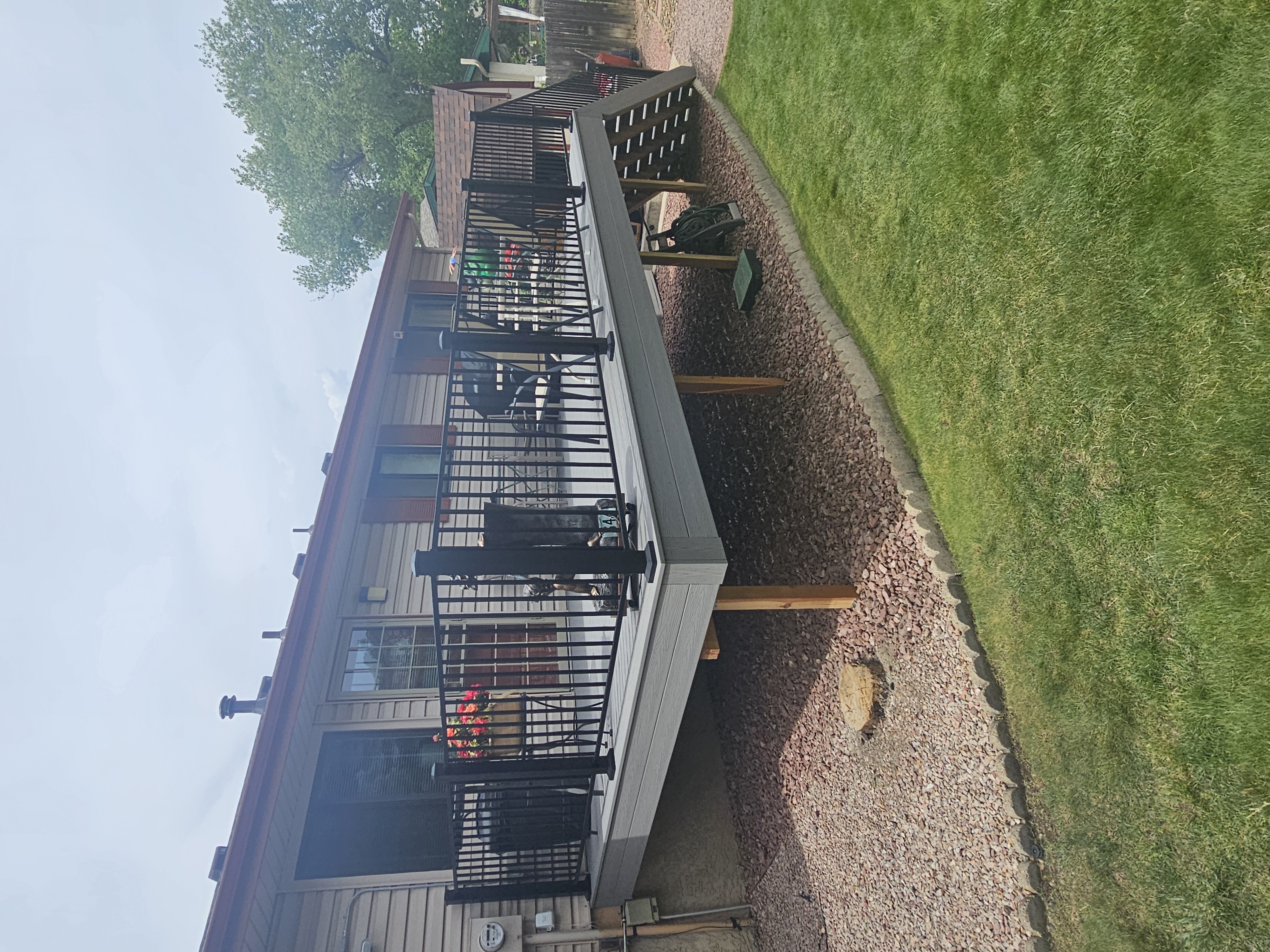 Custom cedar pergola over a backyard deck in the Pikes Peak region