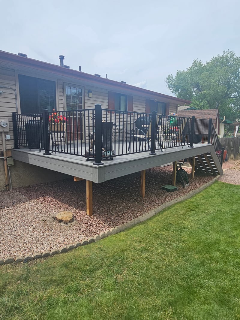Custom cedar pergola over a backyard deck in the Pikes Peak region