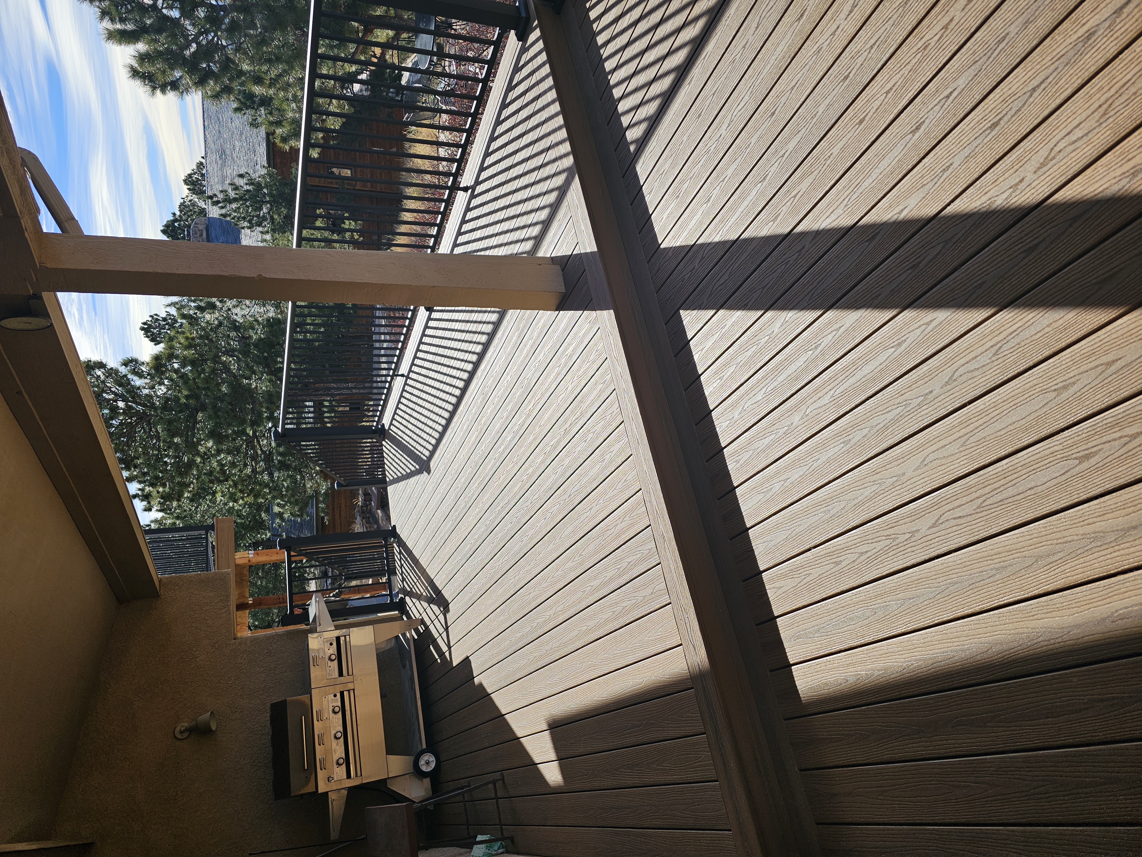 Covered patio and outdoor living space attached to a Colorado Springs home
