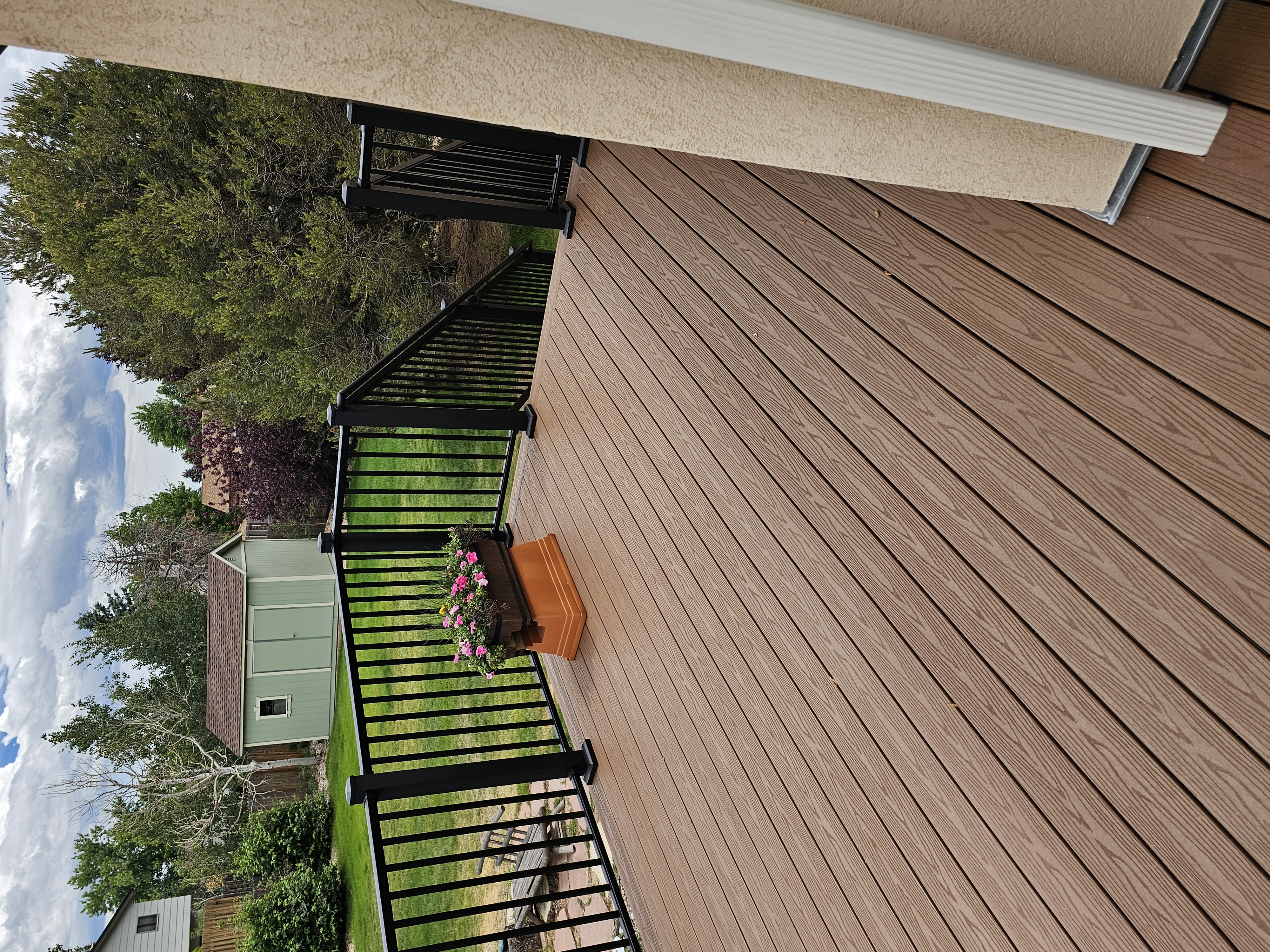 Custom cedar pergola over a backyard deck in the Pikes Peak region
