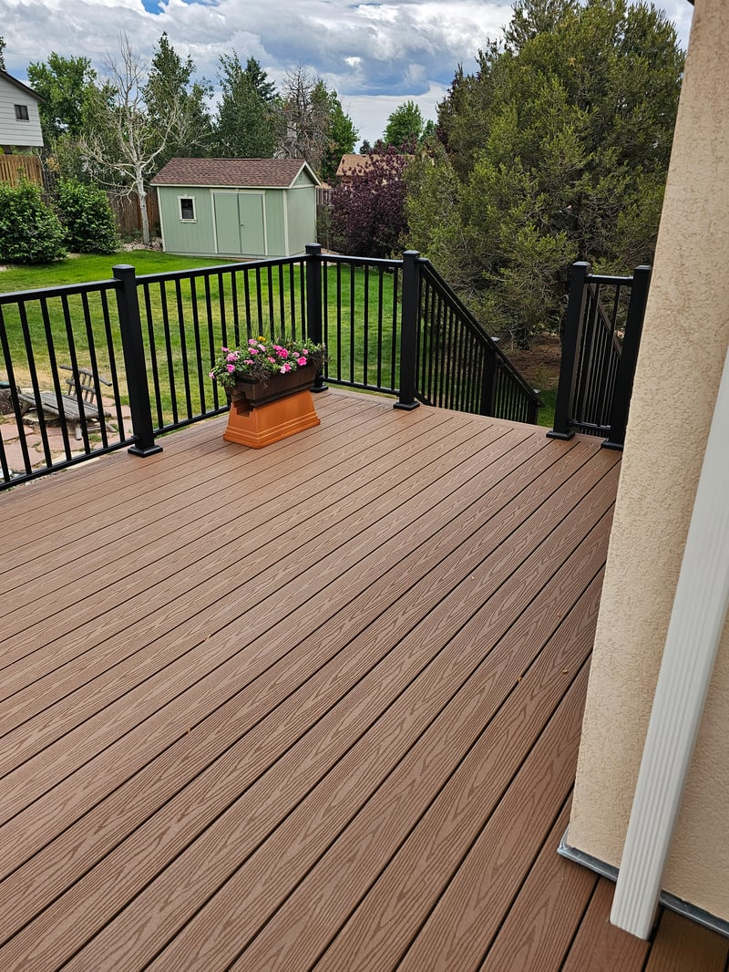 Custom cedar pergola over a backyard deck in the Pikes Peak region