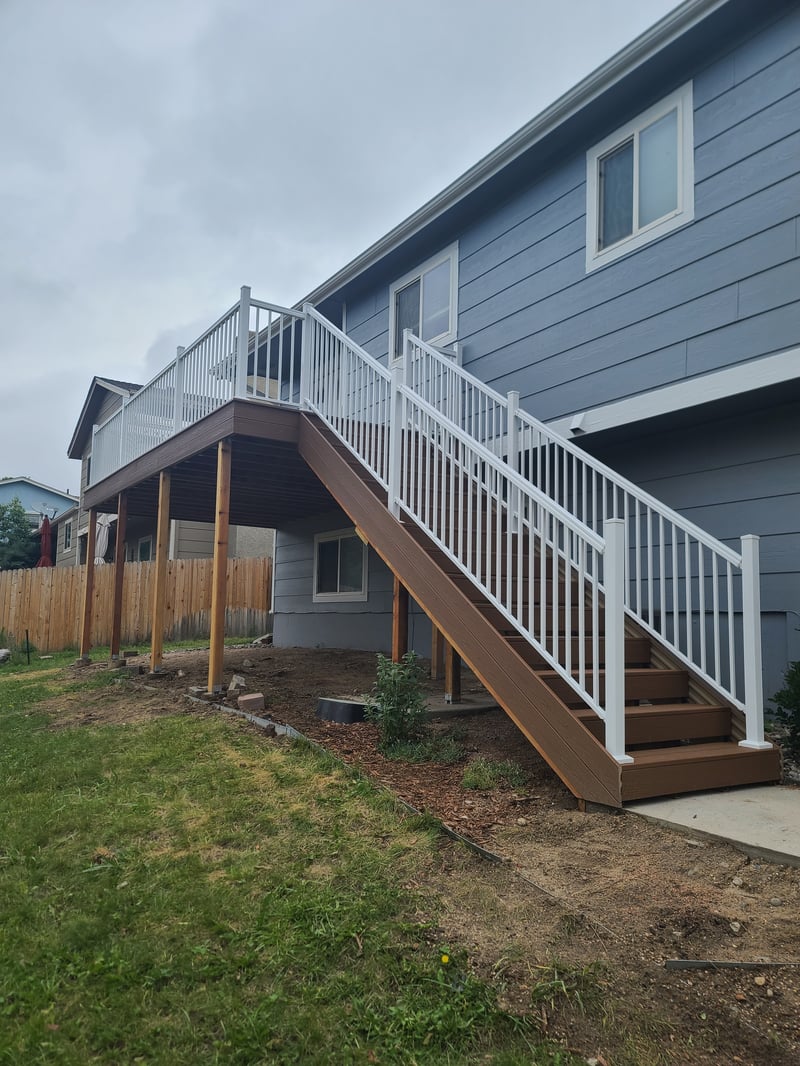 Backyard deck with pergola and outdoor dining area