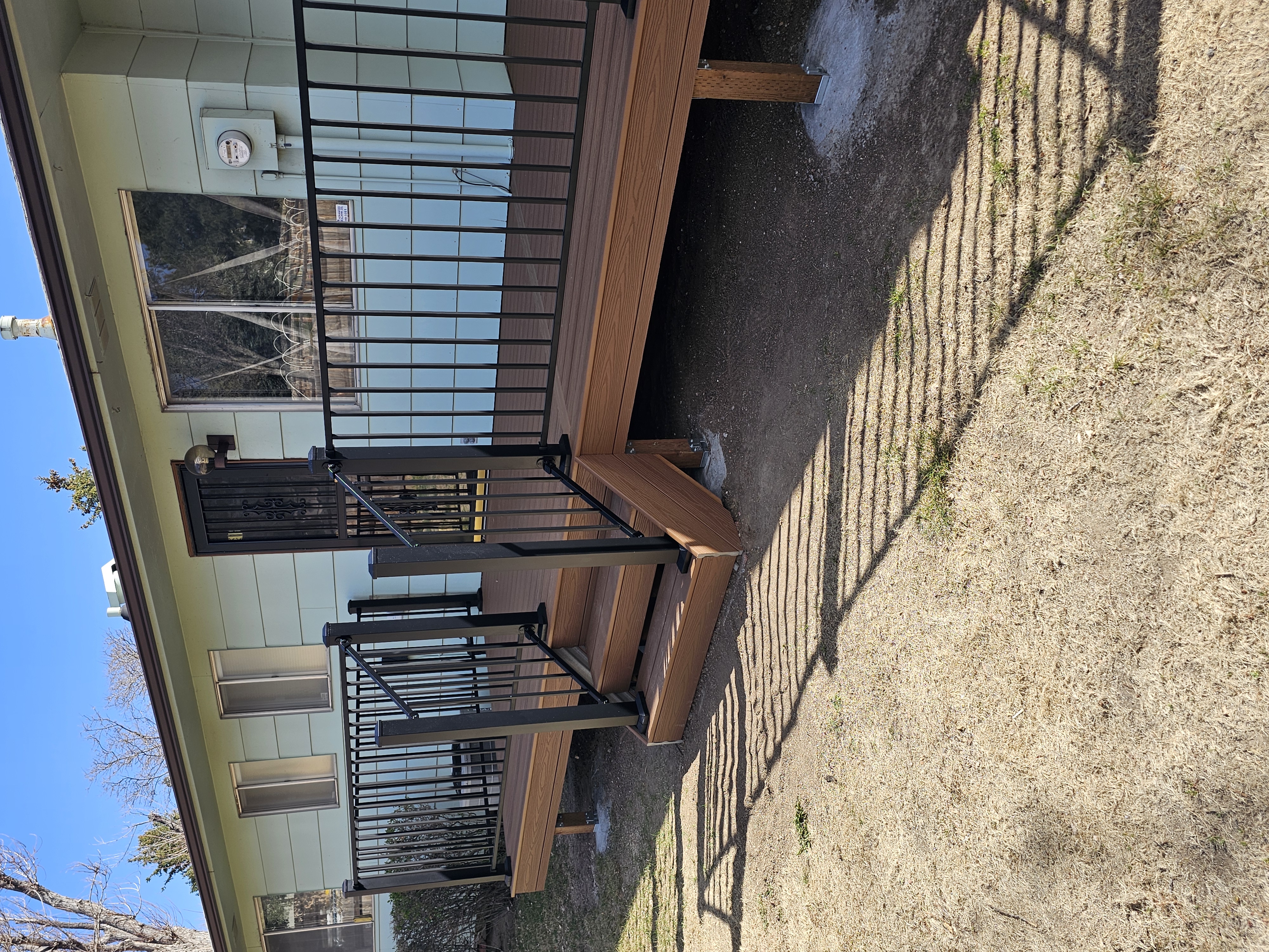 Backyard deck with pergola and outdoor dining area