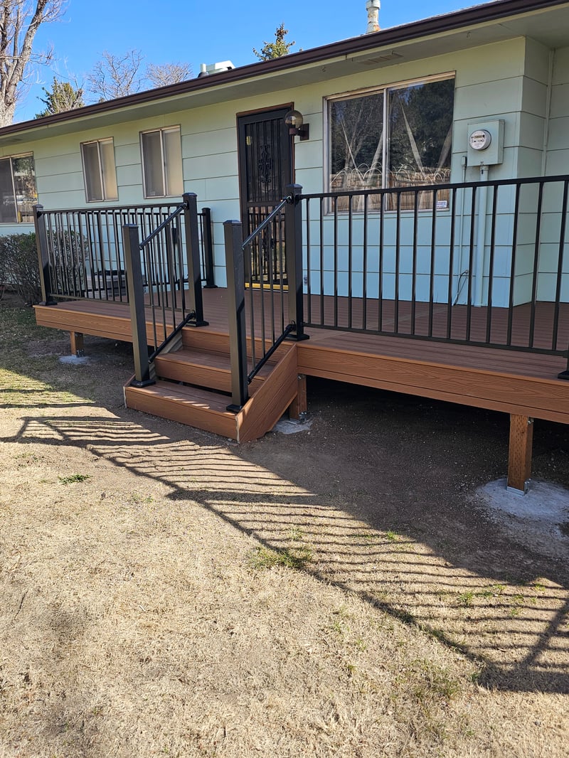 Backyard deck with pergola and outdoor dining area