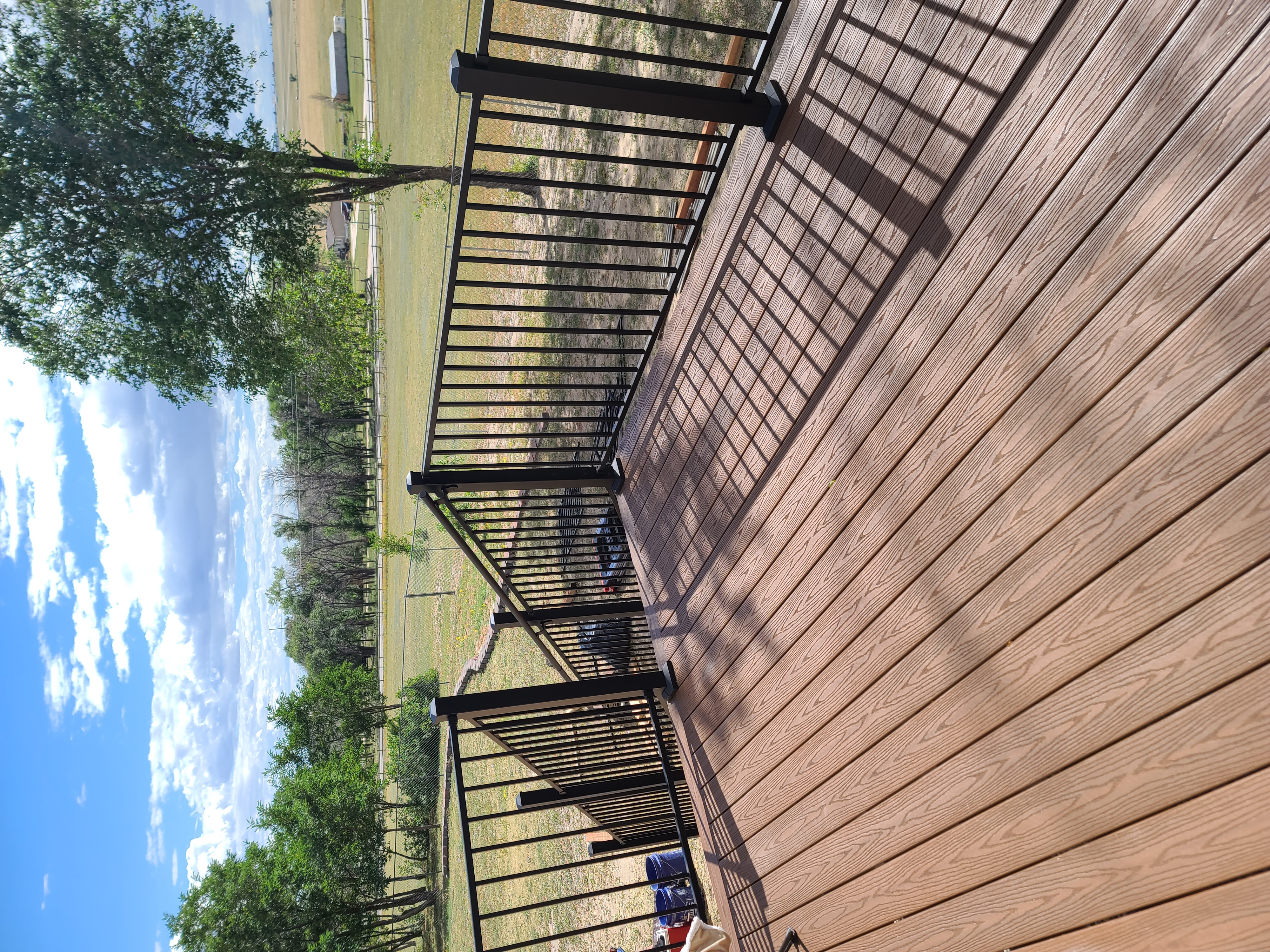 Covered patio and outdoor living space attached to a Colorado Springs home