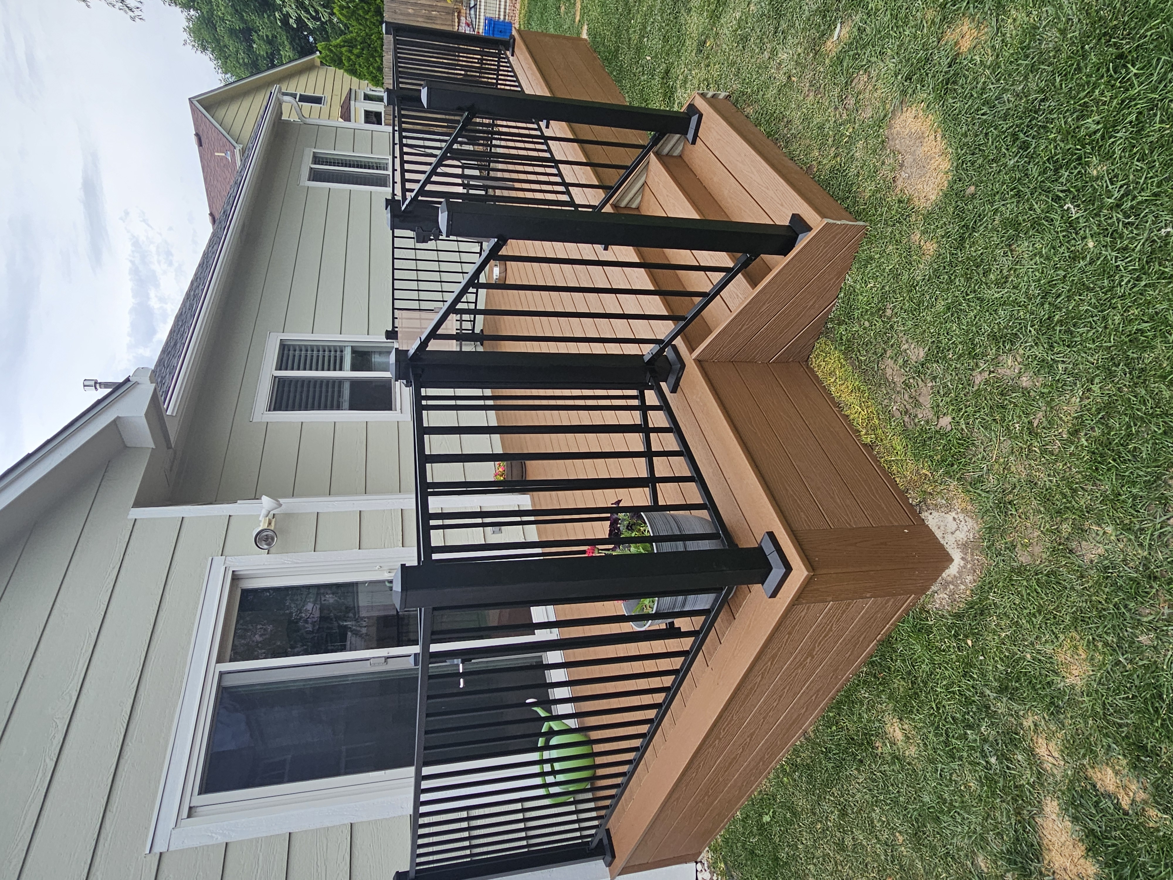 Multi-level custom wood deck with railings in Colorado Springs