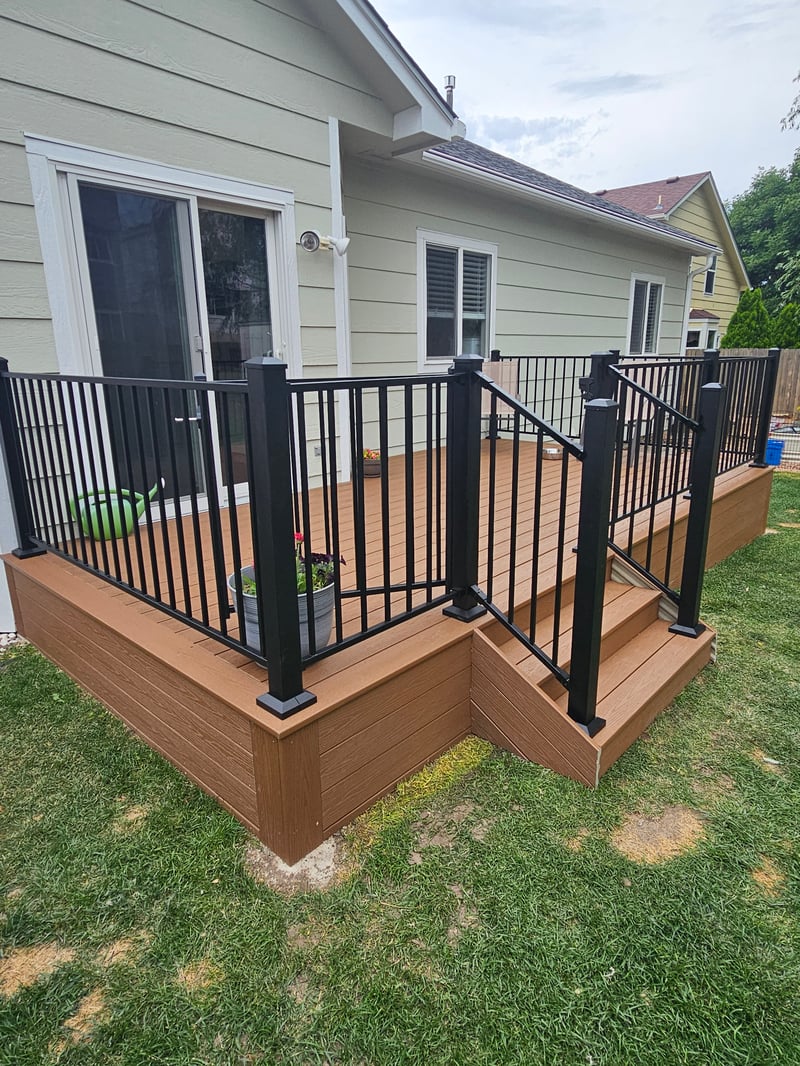 Multi-level custom wood deck with railings in Colorado Springs